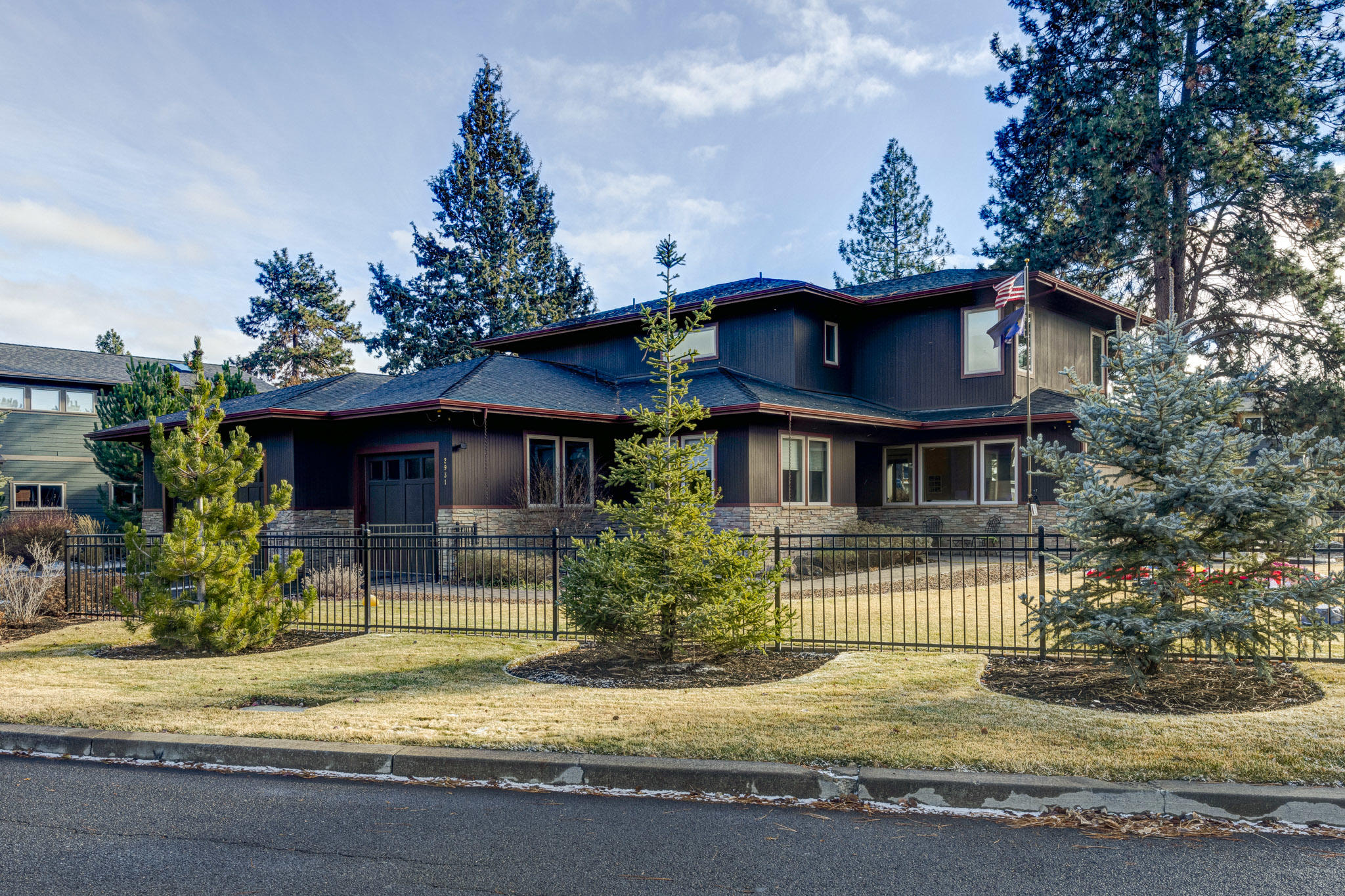 Fantastic 4 Bedroom Home on a large, flat beautifully landscaped lot in Shevlin Crest, on Bend's West Side!   Light filled great room with gas fireplace and built in  cabinetry.  Large Gourmet Kitchen that is beautiful.   The main level also includes one master suite, office/bedroom, half bath and laundry room.   Upstairs includes a large family room with private deck and 2 additional bedrooms.  One upstairs bedroom is a second master suite..  High end finishes and craftsmanship.  The exterior is well maintained with a rare large, flat landscaped .28 acre lot.  There is an attached 3 car garage along with additional parking for a smaller vehicle.   This sought after location is a wonderful place to live.  Mtn Biking, Hiking, Restaurants and Parks to name a few attractions can be accessed on foot/bike from this location.   Please contact us to view this wonderful home.