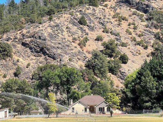 Luxurious Pagnini Custom Home on the Applegate River.  Situated Far from the Road for Optimum Privacy & Serenity.  Stunning River & Mountain Views.  Single Level, Dramatic Entry, Open & Thoughtful Floor Plan. Gourmet Kitchen w/Granite, Island, Double Ovens, Dacor Cooktop, Pantry & Abundance of Storage.  Dining Nook & Elegant Formal Dining Rm.  Family Rm has an Entertainment Center & Built Ins, Woodstove, Custom Coffered Ceiling & Fan.  Living Room Vaulted Ceilings & Gas Fireplace.  Oversized Primary w/Custom Coffered Ceiling, French Door w/Patio Access, Large Bath w/Jetted Tub, Walk in Closet & Granite Counters. 2nd Primary w/Built Ins, Sliding Glass Closets.  Oversized Laundry. Doug Fir Cabinets, Slate & Hardwood Floors w/Granite Inlays, Storage Galore.  Irrigated Acreage.  Wonderful Horse Property with Trails Directly Across the Street.  Property Suitable for Ranch or Farming.  Unique Micro Climate. Excellent Solar Exposure.  Sophisticated Domestic Water Filtration.
