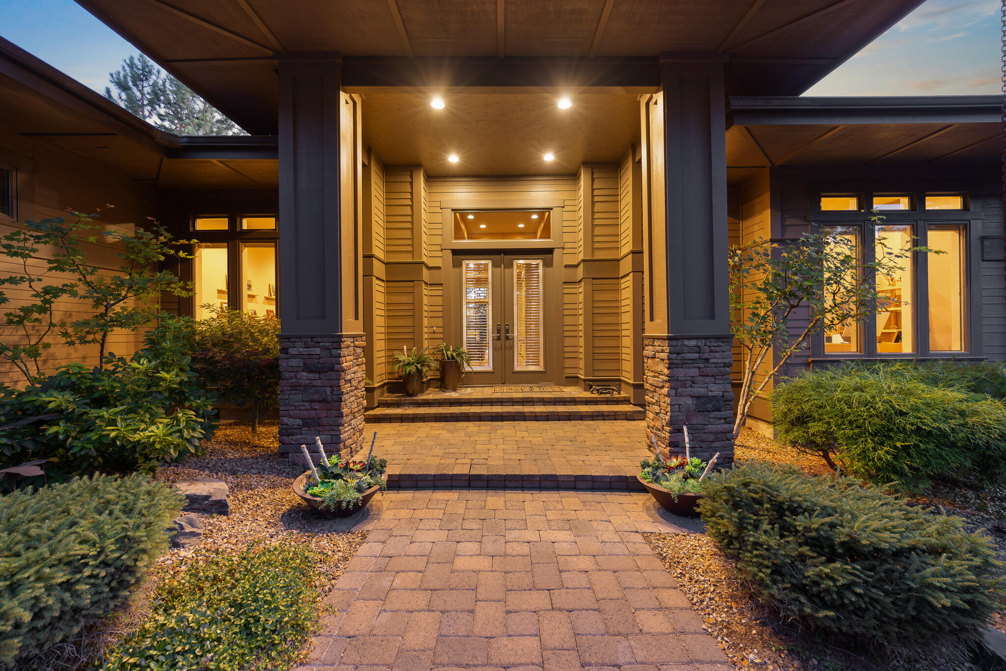 Welcome to beautiful Awbrey Glen! This stunning single-level home captures Cascade Mountain views & offers luxurious living throughout. This 3 Bedroom includes 2 additional rooms for an office/den. The chef's kitchen is a true standout, featuring a large island, high-end appliances, & ample space for entertaining. The great room is warm & inviting with custom built-ins & a fireplace, all perfectly framed by expansive windows. The spacious primary suite is a private retreat with a spa-inspired bath boasting heated floors, a soaking tub, walk-in shower, heated towel rack, & a custom walk-in closet. Two additional en suites offer comfort & privacy, each with direct access to the back deck. Step outside to a covered patio & hot tub—ideal for soaking in the views year-round. The oversized 3-car garage includes tall doors, built-in storage, & a utility sink. This exceptional home offers the perfect blend of elegance & comfort.