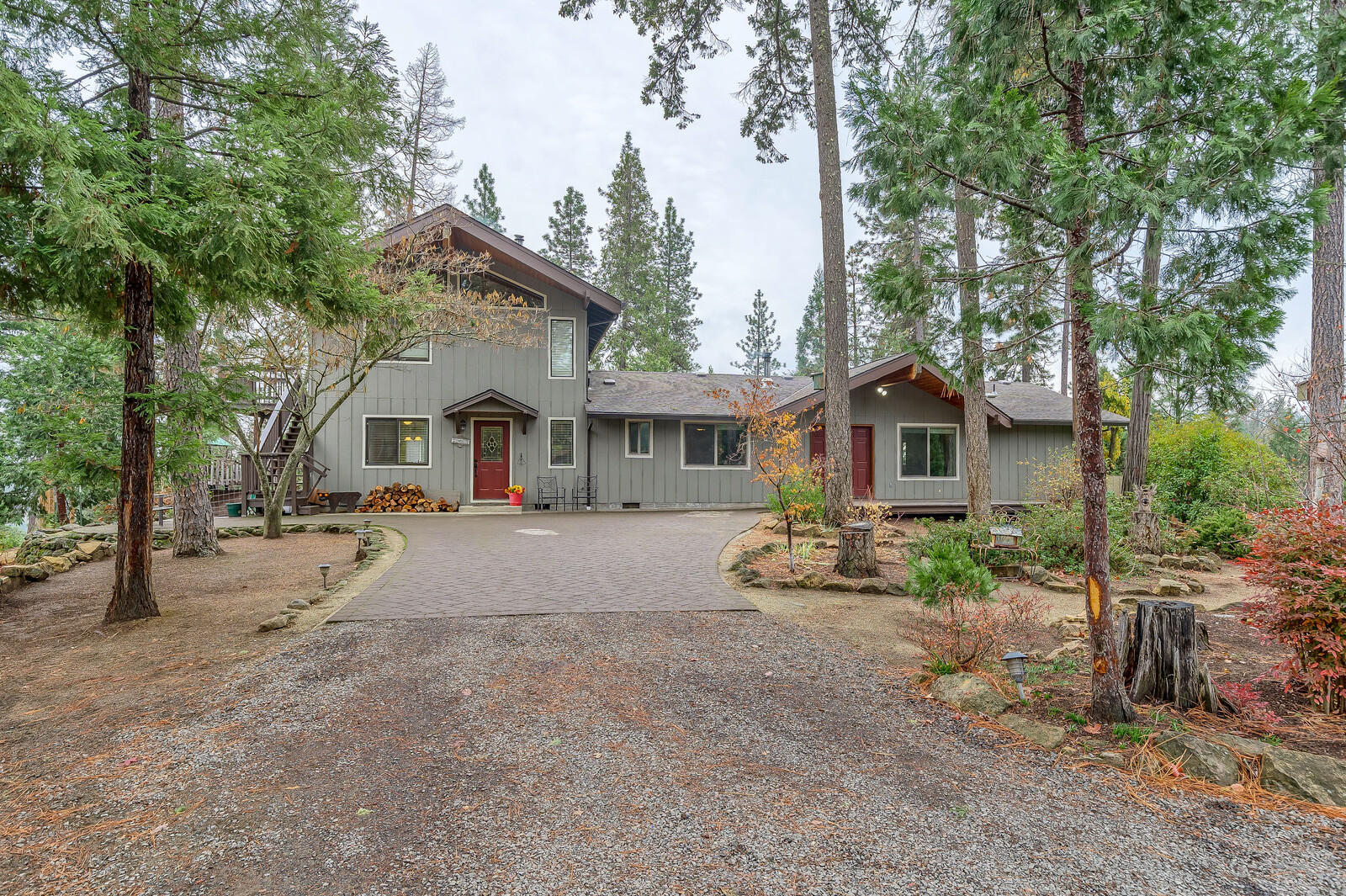 One of a kind horse property ~ Tucked well off the beaten path with extreme views and unmatched privacy sits this family run horse ranch. This outdoor playground features over 80 acres and is complete with boarding facilities, outdoor arena, large covered arena, turn-out areas and miles of wide and accessible riding trails. The views stretch across the valley from many points all the while totally secluded and private. The large 2 FAMILY SET-UP home features 2 living areas, 2 kitchens, 2 master suites, large expansive trex decking, and custom touches throughout with separate entrances for each area. The large barn has bunkhouse/living quarters with full bathroom plus a large garage with an additional media/craft room. A large concrete pad with RV hookups is perfect for extended family or rental opportunity. All this borders over 750 acres of BLM land for you to enjoy! 15 minutes to Medford make this a must see property in a must have location.
