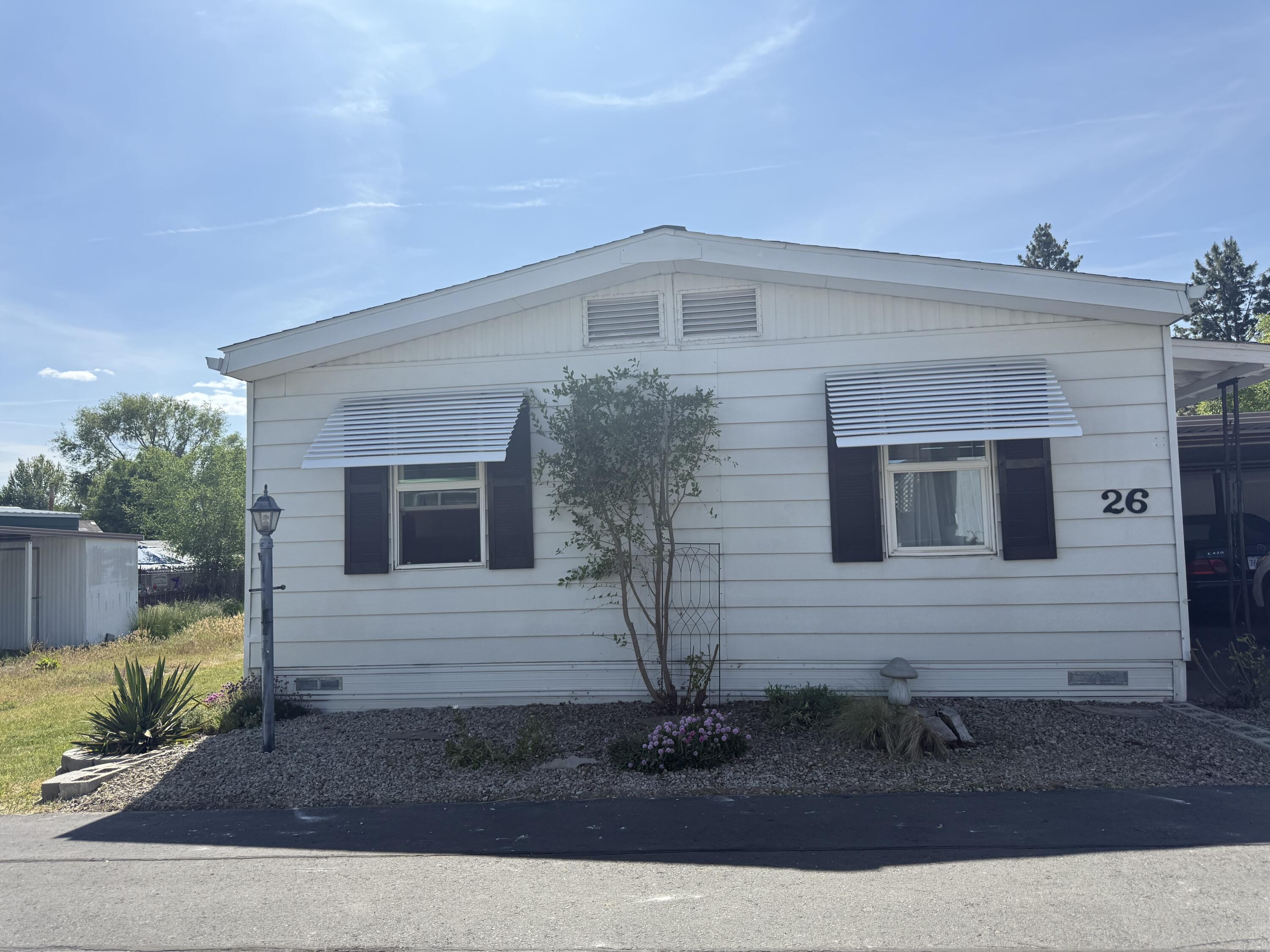 Cute, clean, move-in ready home In Town & Country Mobile Estates! This house has thoughtful updates throughout and has been well cared for. Fresh paint, landscaping & fancy electronic pet door that will stay with the home. The primary bathroom has a huge soaking tub with tile & newer appliances all staying. This is NOT a 55 and older park. Nice curb appeal and a private little courtyard along with the shed & covered carport for parking. Assessment covers water, sewer, trash & dumpster access.