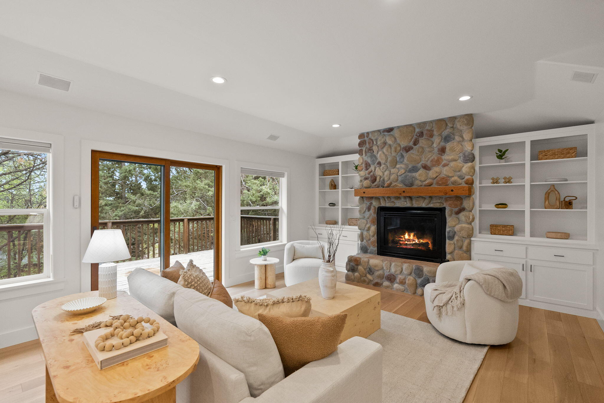 Tucked into one of NW Bend's most sought-after neighborhoods, this bright, beautifully updated home is full of surprises. Upstairs, soak up natural light, cozy up by one of two fireplaces, and enjoy stylish new engineered hardwood floors and a dreamy remodeled kitchen with fresh appliances. Two living areas and an office offer room to spread out. Downstairs, discover two bonus rooms (not in sq ft), including one with a roll-up door—perfect for bikes, art, gear, or your next big idea. Outside, relax on two decks, explore the spacious backyard, and take advantage of massive under-house storage. This home is just minutes from parks, the river, downtown fun, and neighborhood tennis courts. Come see where your next adventure begins!