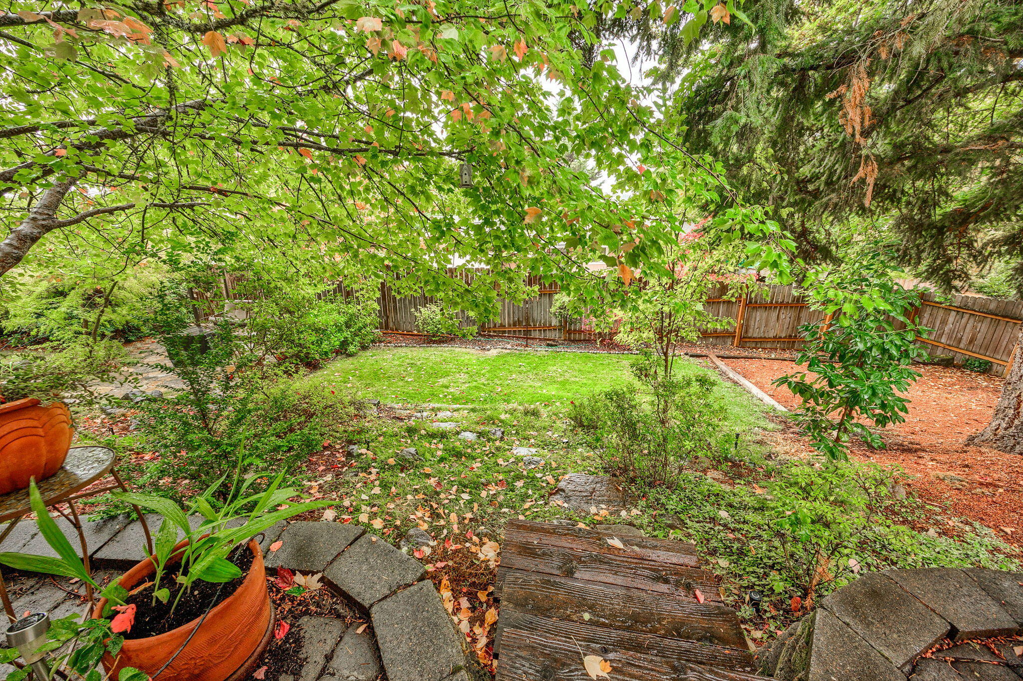 Welcome to your dream home! This charming single-level ranch is located in one of East Medford's most desirable neighborhoods. With a bright, welcoming atmosphere, it combines comfort and style seamlessly.

Inside, you'll find an open floor plan designed for both relaxation and entertaining. The cozy living room, complete with a gas fireplace, serves as the heart of the home.

The beautifully landscaped yard offers a peaceful retreat, featuring a tranquil water feature that enhances the serene setting. It's the perfect spot for morning coffee or hosting summer barbecues.

This is your chance to own an exceptional property that offers both peaceful living and easy access to nearby parks, shopping, and top-rated schools. Don't miss out on this perfect blend of comfort and convenience.