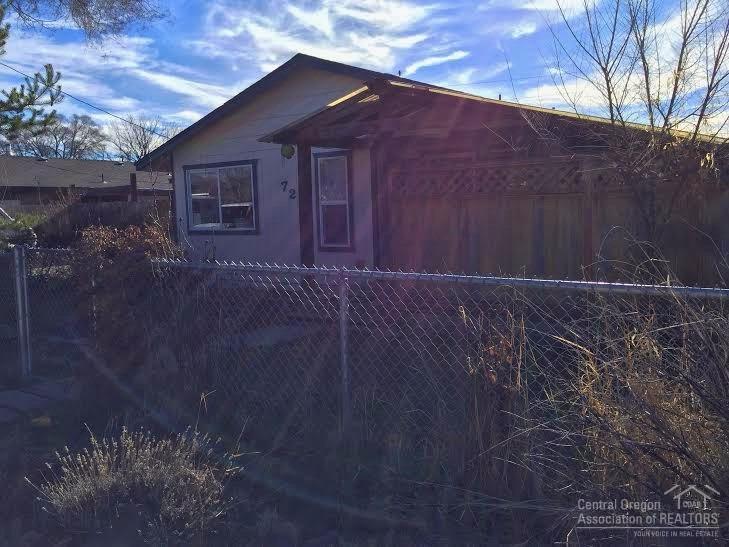Completely redone & ready to go! Huge kitchen w/tons of custom Hickory cabinets, central island w/ NEW downdraft range & bar. Laminate, tile & NEW premium carpet. Spacious Master with private patio & door to the back yard too. Covered front deck is very private & great for entertaining. Property is fully fenced & dog friendly. Alley access means no neighbors across the back fence. Choose your exterior paint color!