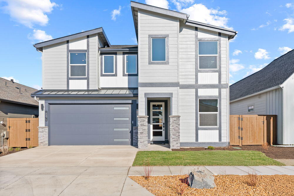 Easton Phase 2 - homesite #179 - MOVE IN READY! - This stunning upgraded Morgan on Lot 179 is completed!  This spacious 2,837 sq. ft. home offers modern living featuring an open-concept layout, main-level home office, and a spacious upstairs flex room with mountain views. Enjoy upgrades like 8' main-level doors, clear frameless glass shower door in the primary suite, fireplace cabinets, upper laundry cabinets, wood shelving throughout, and a upgraded KitchenAid 5-piece appliance set. Features include quartz counters, luxury vinyl plank flooring, vaulted great room, home office, soft-close cabinets, A/C, tankless water heater, fencing, backyard landscaping, bonus garage storage and much more. Located in SE Bend's Easton community offering access to pools, parks, and walkable streets. Photos of actual home virtually staged.  Blinds and refrigerator recently added as well.