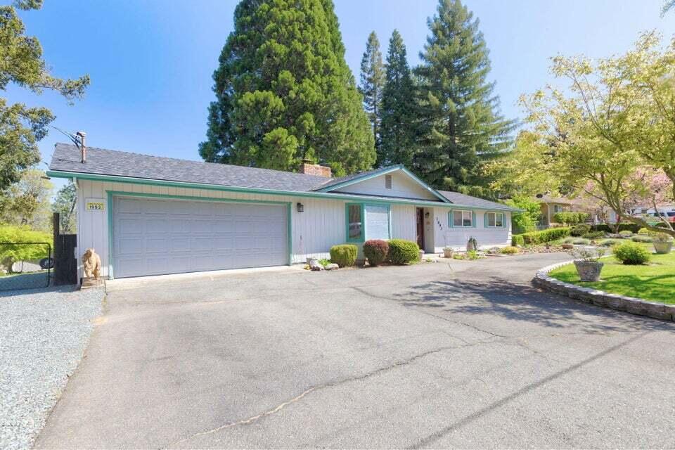 Discover the perfect blend of comfort and convenience in this well-maintained single-family home on a spacious 0.58-acre lot. This 1,300 sq ft property features three bedrooms, two full baths, and an updated kitchen that complements the welcoming atmosphere. A cozy fireplace in the living area enhances the warmth, making it an inviting space for relaxation and family time. Recent updates include a new roof installed less than two years ago, ensuring long-term durability and peace of mind. A newly installed ductless climate system offers efficient heating and cooling year-round. Step outside to a large 324 sq ft wood deck that overlooks the stunning landscape, ideal for relaxation and social gatherings. This home is connected to the Grants Pass Irrigation District (GPID), ensuring ample water supply for your landscaping needs. It also includes a two-car garage with extra storage. Located on a peaceful cul-de-sac in Grants Pass, near community amenities. Enjoy stunning views and peace!