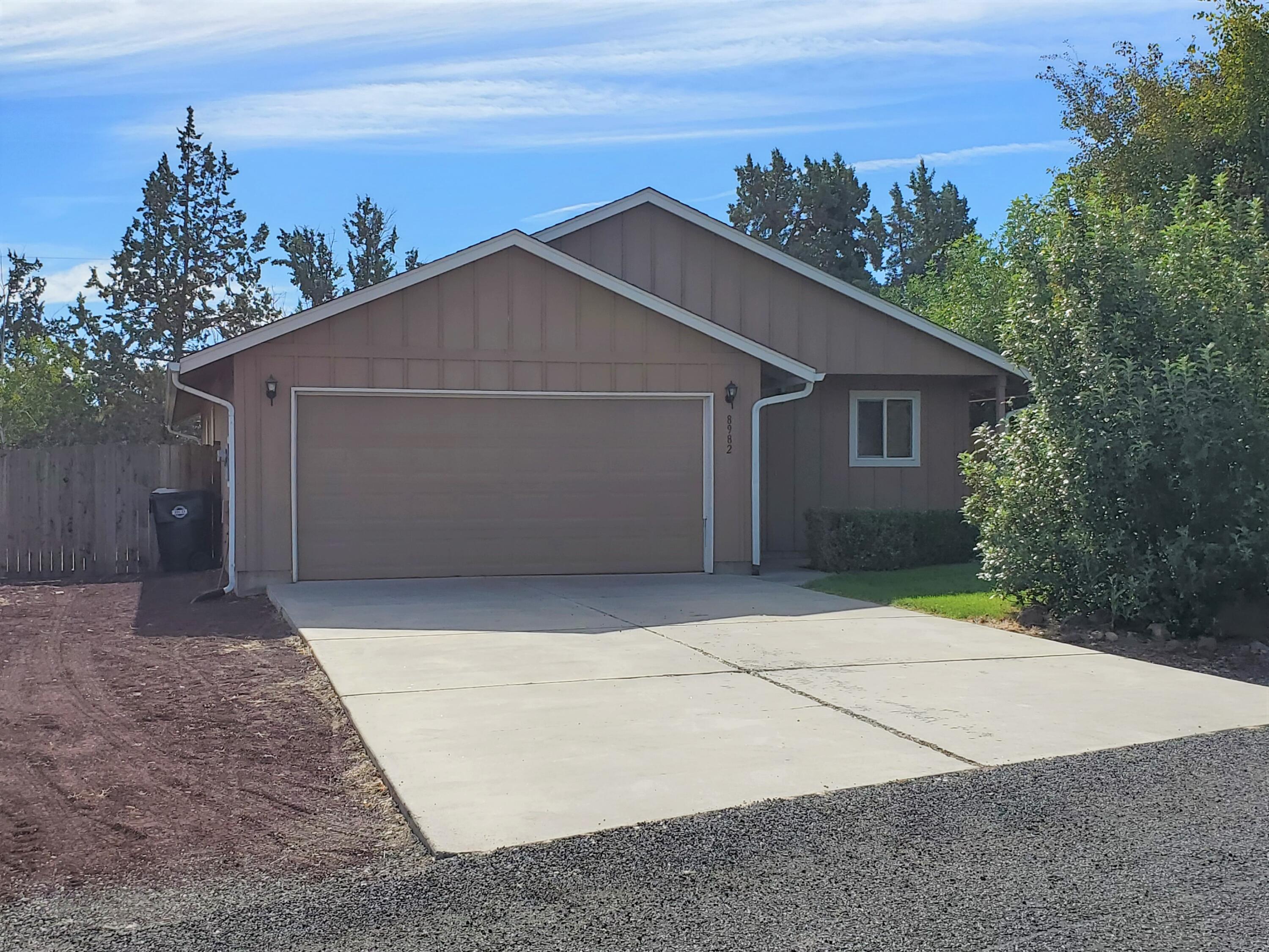 This little house lives large with 3 bedrooms and 2 baths in an open concept plan. Pantry, walk in closet, two-car garage, separate laundry room. Over 7000 sq foot homesite fully fenced with underground sprinkler system. Plenty of room on the side to park an RV. Spacious  ground level deck on the east side for summer fun!  All this with a view of Smith Rock and close to shopping in Terrebonne. Easy access to Hwy 97.
