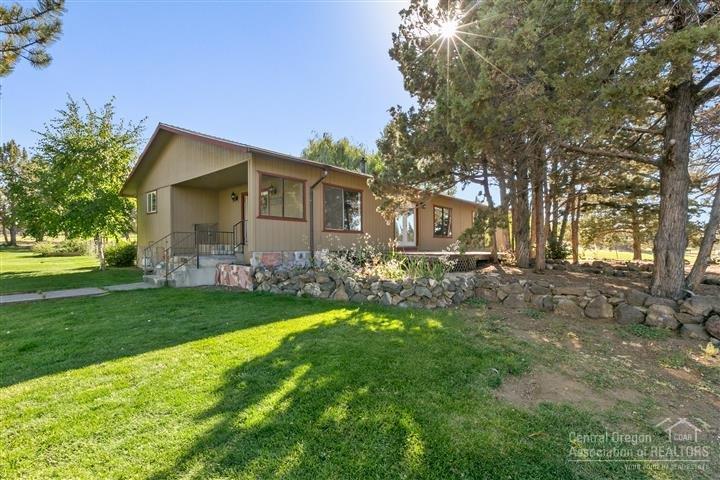 Everything and more is ready for you on this 5 acre Hobby or 4-H farm! Including fully fenced and cross fenced with plenty of room for animals to roam in the 3 separate pastures, pens and corral. Also has 3 acres irrigation, a 24x48 barn, pond, 20,000 gallon cistern, greenhouse and lots of mature landscaping. Single level home features a large gourmet kitchen, heated floors throughout kitchen, dining area and main bthrm. Plus nice & quiet, close to BLM & just minutes to town, schools, shopping and medical.