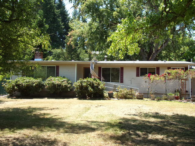 REDUCED If you are looking for river front property w/o flood insurance currently-this great accommodating home is it! River and property line across the street. Lg level parcel has home positioned right to sit back from road yet allow great use of property.Yard irrigation from well or pump you choose (no pump avail), h20 use grandfathered in. Place offers attached gar, RV parking with access to large 26 x 26 shop with taller door access. There is a gazebo,deck and very stately trees. Roof is appx 4 yrs old, Heat is propane, and central a/c. flooring is wood, w/vinyl baths and kitchen. Pellet stove insert (certified) with heatalator fan for distribution. Siding is only appx 12 years old. Kitchen has large island with cooktop/grill, dbl wall oven and tons of storage/counter space. Separate dining rm w/storage. Appraised Feb 2025 for $395000 priced to move! Great place if you want to be rural yet only appx 18 miles from Roseburg. Furnishings for sale or negotiable with acceptable offer.