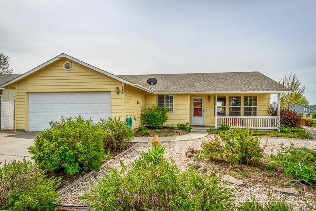 This single level cheerful, light and bright home on a large corner lot in this tidy neighborhood is just minutes from downtown Prineville. Features include a covered front porch, mature landscaping and storage shed in the backyard. It provides a great opportunity for a first time homebuyer, an investor or a downsizing homeowner. The vaulted ceiling in the great room creates a light, open and inviting space. Laminate floors in the great room, oak cabinets in the kitchen and new kitchen countertops, range oven/range, refrigerator and cadet heaters make this turn key and ready to move in.