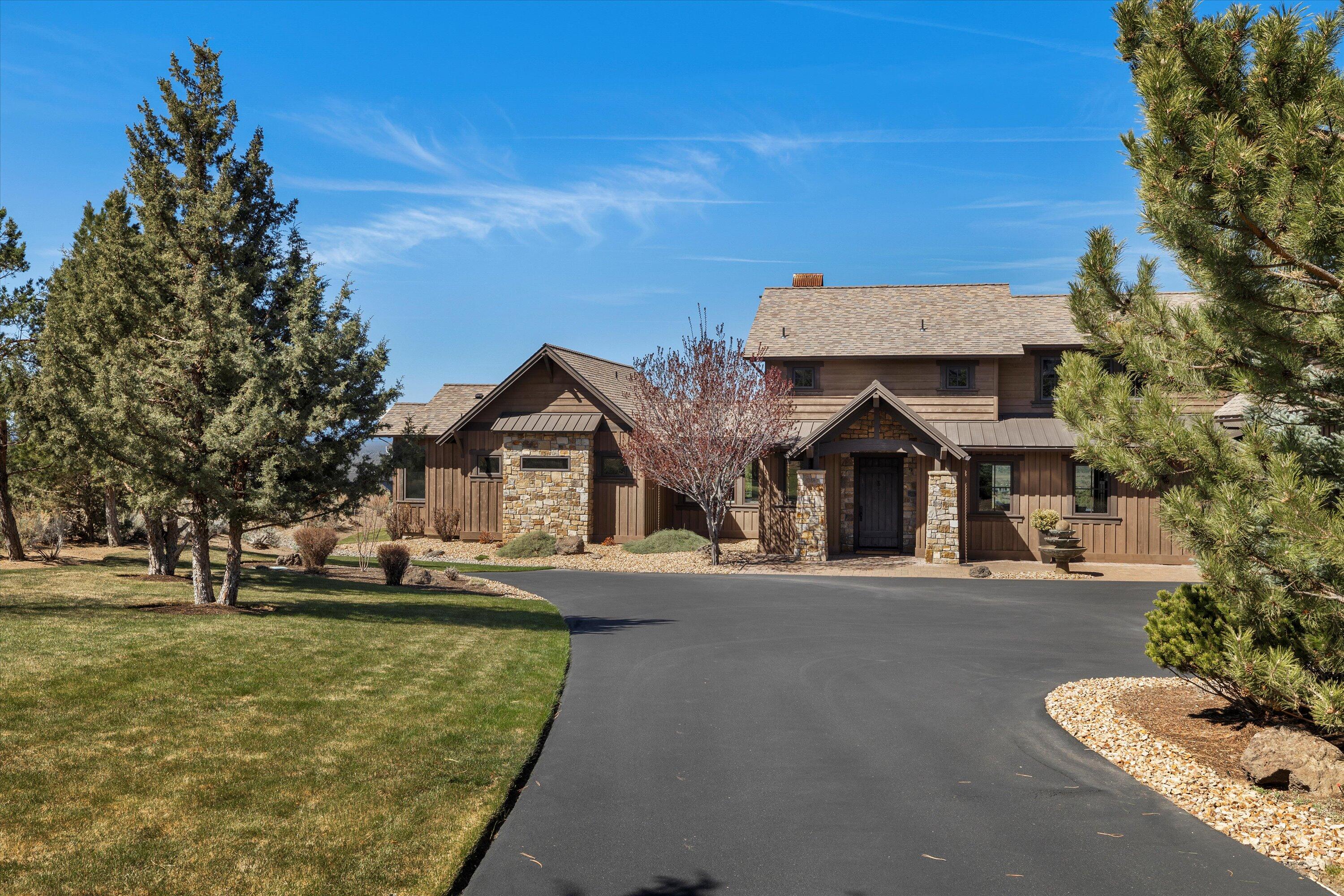 Unparalleled Custom Home with panoramic Cascade Mountain views. Distinctive craftsmanship & quality of materials abound as you enter into the open, vaulted great room & warm kitchen/dining area. Step outside, you will find a deck that spans the length of the entire home complete with a gas fire pit, hot tub, and outdoor kitchen. The primary bedroom offers vaulted ceilings, a warm fireplace, & outdoor access. The primary bath features a well-situated soaking tub & large shower with dual vanity. An additional bedroom with full bath & a spacious laundry room complete the main floor. Upstairs, you will find another bedroom with full bathroom, a den with built in office, two sets of built in bunk beds, a family room with kitchenette & an impressive large 4k laser projector with 120'' screen. A large 3 bay garage finishes the home.