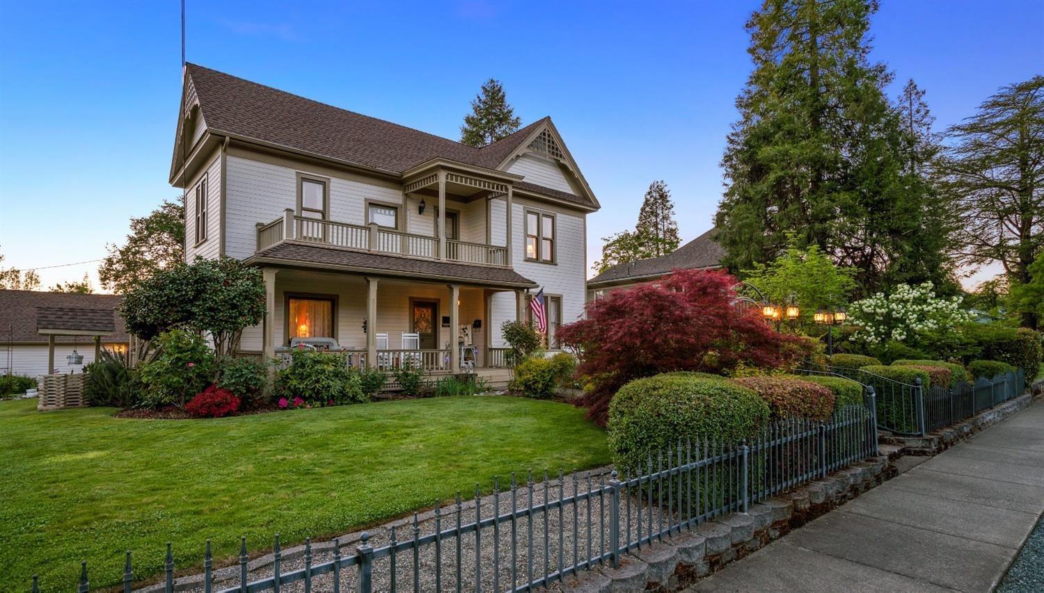 This is the Thomas Croxton Victorian Mansion constructed by the man responsible for naming 'Grants Pass'. This 4BR/3B, home with two fireplaces sits on a .32 acre, corner lot. The home underwent an extensive $120,000 upgraded/remodeled in 2019. New electrical panels, heating/cooling system, blown-in attic insulation and extensive painting. Custom new pantry and luxury laundry room with brand new high capacity washer/dryer. In addition to the formal living and dining areas, the main floor has a wood paneled den/office with fireplace and pocket doors. The home has tons of updated closets and storage spaces. The detached garage has a new built-in work bench area and epoxy floor. The separate back part of the garage is a remodeled art studio. The garage building has a full attic for storage! The property is listed on the National Historical Registry. If you're looking for a prestigious historical Victorian home, all with in walking distance to town, this is truly a unique opportunity!