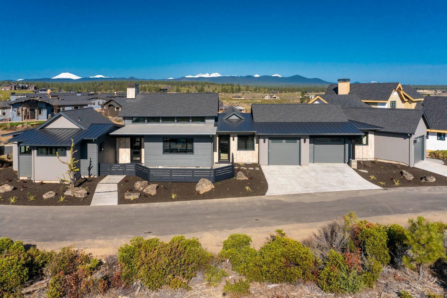 Custom designed to maximize the setting of a gorgeous Tetherow lot in the beautiful Cascade Vista neighborhood, this contemporary farmhouse inspired design incorporates an open floor plan with oversized doors and windows throughout. An Earth Advantage home, it features: vaulted ceilings, Western facing exposure, high end finishes and outdoor access to patios from the living spaces and each of the bedrooms. This single level 3 Bed, 3.5 Bath is complete with an included golf membership, a 3 car garage, expansive patio and outdoor living space. Golf Membership Initiation included!