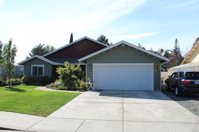 This home was built in 2012 by Cliff Woodruff. It makes the best use of the 1346 square feet. Vaulted ceilings in the living area make this home feel very spacious. This Home offers a split bedroom floor plan. There is a nice patio off the living area overlooking the beautiful back yard. If you have been contemplating building, you are aware of the small lot sizes. . This home is situated on .21 acres. Well established landscaping welcomes you. There are covered patio's in the front and back yard. RV parking is also available. Current owner can park his log truck on the side and still have ample parking for other vehicles. There is an attached, finished, two car garage. Drop down ladder in the garage access additional storage space. This home is conveniently located in the NE part of Grants Pass.