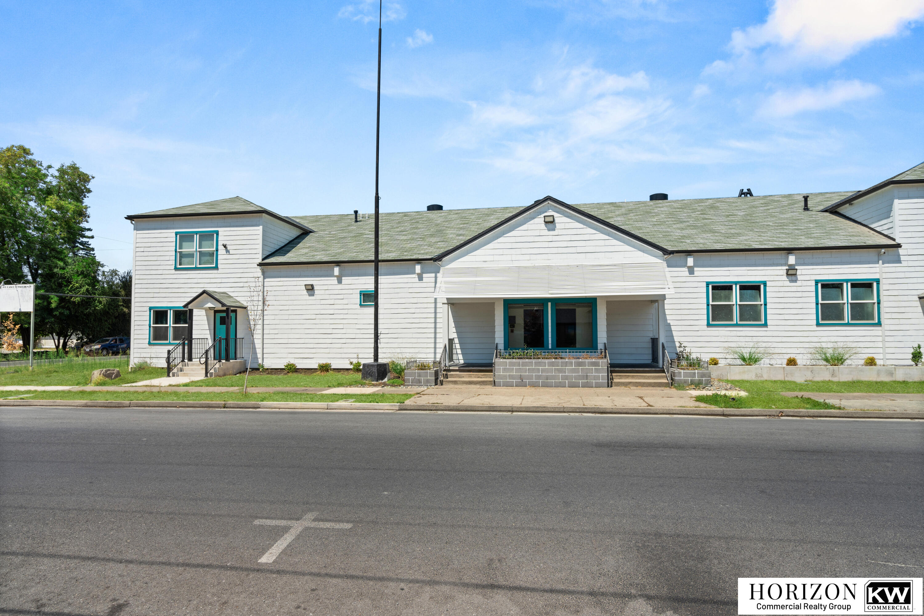 Available for lease: unique and highly adaptable move-in ready space located minutes from downtown Grants Pass. The ±4,227 SF ground-level suite features a spacious open-concept great room—perfect for fitness, arts and entertainment, educational programs, performance events, or collaborative workspaces. The free-span layout allows for maximum flexibility in configuration and use. Includes 2 ADA restrooms, kitchen and built-in bar, wired for sound and fully sprinklered. Upstairs, an additional ±931 SF unit is available for lease—ideal for offices, creative studios, or a potential live/work setup (subject to zoning and use requirements).  Outside, the property offers designated parking, ample street parking, and potential after-hours access to adjacent lots (with permission). A large side yard may also be available for tenant use with landlord approval—perfect for events, outdoor classes, or garden seating. Tenant pays pro-rata utilities and a contribution towards landscaping maintenanc