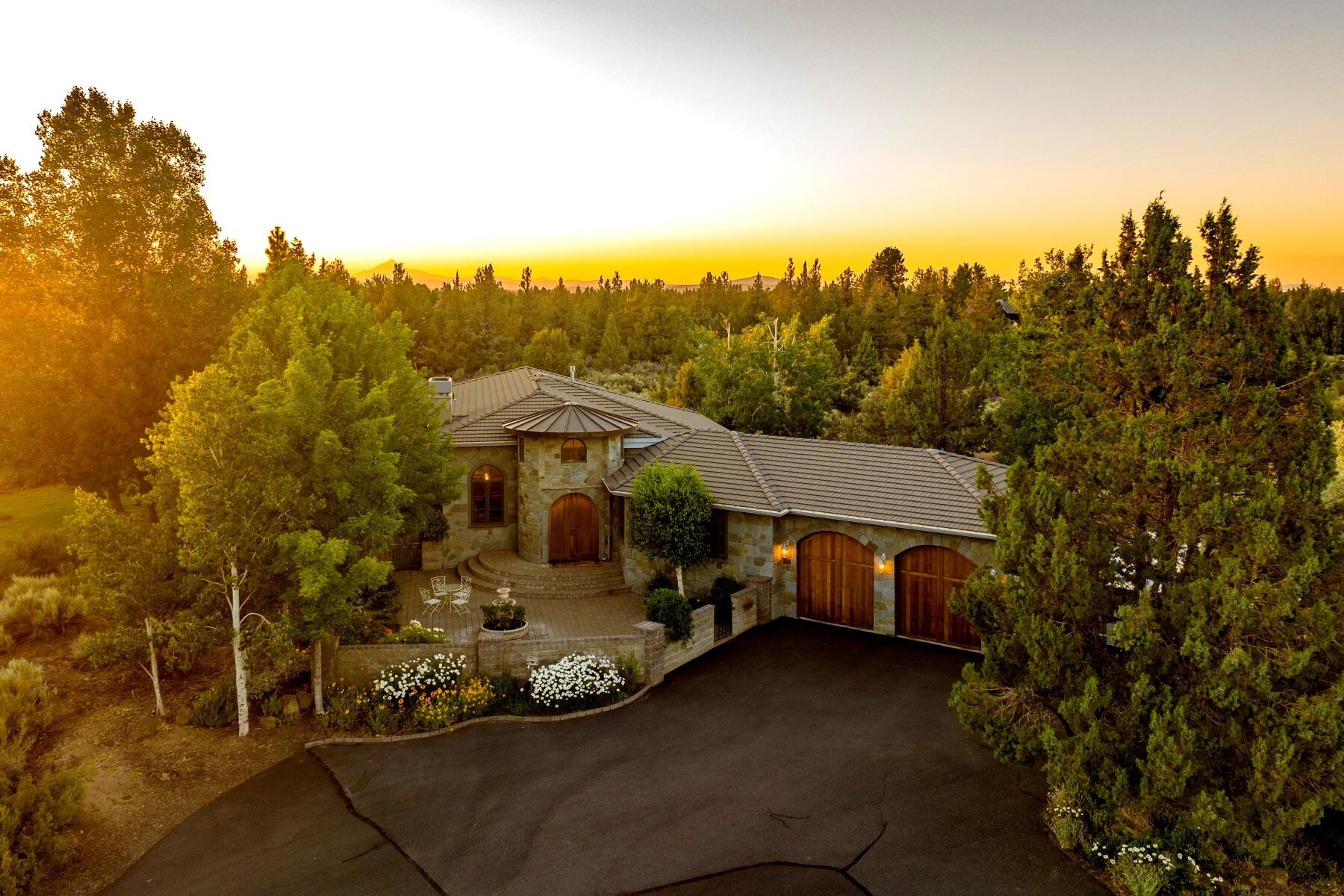 Easy to care for Horse Property/Hobby Farm on 19 private acres w/7.48 acres of
irrigation on a private cul-de-sac in NE Bend. 
 Single level, European-inspired home blends modern elegance with Old World charm and features a Telluride stone exterior and exquisite design elements including arched windows, concrete and rough-hewn flooring,
Travertine finishes and stone accents. Stunning foyer enters into a Great Room with
soaring ceilings, fireplace and dining area. Spacious Gourmet kitchen was remodeled by Neil Kelly in 2014 and features high end appliances, custom cabinets and luxury granite. Family room with built ins, gas fireplace and sliders that lead to a beautifully landscaped backyard, sparkling pool and hot tub. Primary Suite has a Luxury Bath with jetted tub and huge walk-in closet. Two guest suites share a bath. Large barn/shop with covered RV spaces and an unfinished loft. Two Fenced pastures.  Fabulous
location close to hospital, shops, amenities and wonderful schools!