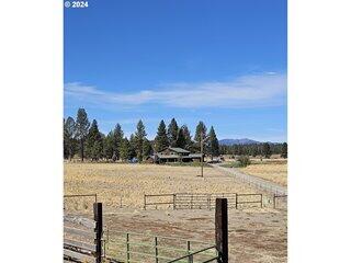 This is a spectacular recreational ranch. If you want the ranch lifestyle with room for your cattle, farm/gardening, food plots for wildlife, waterfowl, upland gamebirds and very large Rainbow Trout, then this is your property. Four hundred and seventy-five deeded acres with close to two miles of the Sycan River running through the middle of your ranch. Allowing private access from both sides of the river. With a beautiful freshly updated 5,420 sq. ft. home containing 5 bedrooms and 4.5 baths. There is also a 1 bedroom, 1 bath in-law house and 2 wells and 2 septic systems. Fenced backyardgardening shed, greenhouse and planting boxes. You will find about 45 acres of timber and 209 acres of irrigated ground. This property has been developed for wildlife, hunting and fishing.  with Mule Deer, Waterfowl and Valley Quail and Pheasant. There are two 6 tower Valley pivots for the most efficient irrigation.