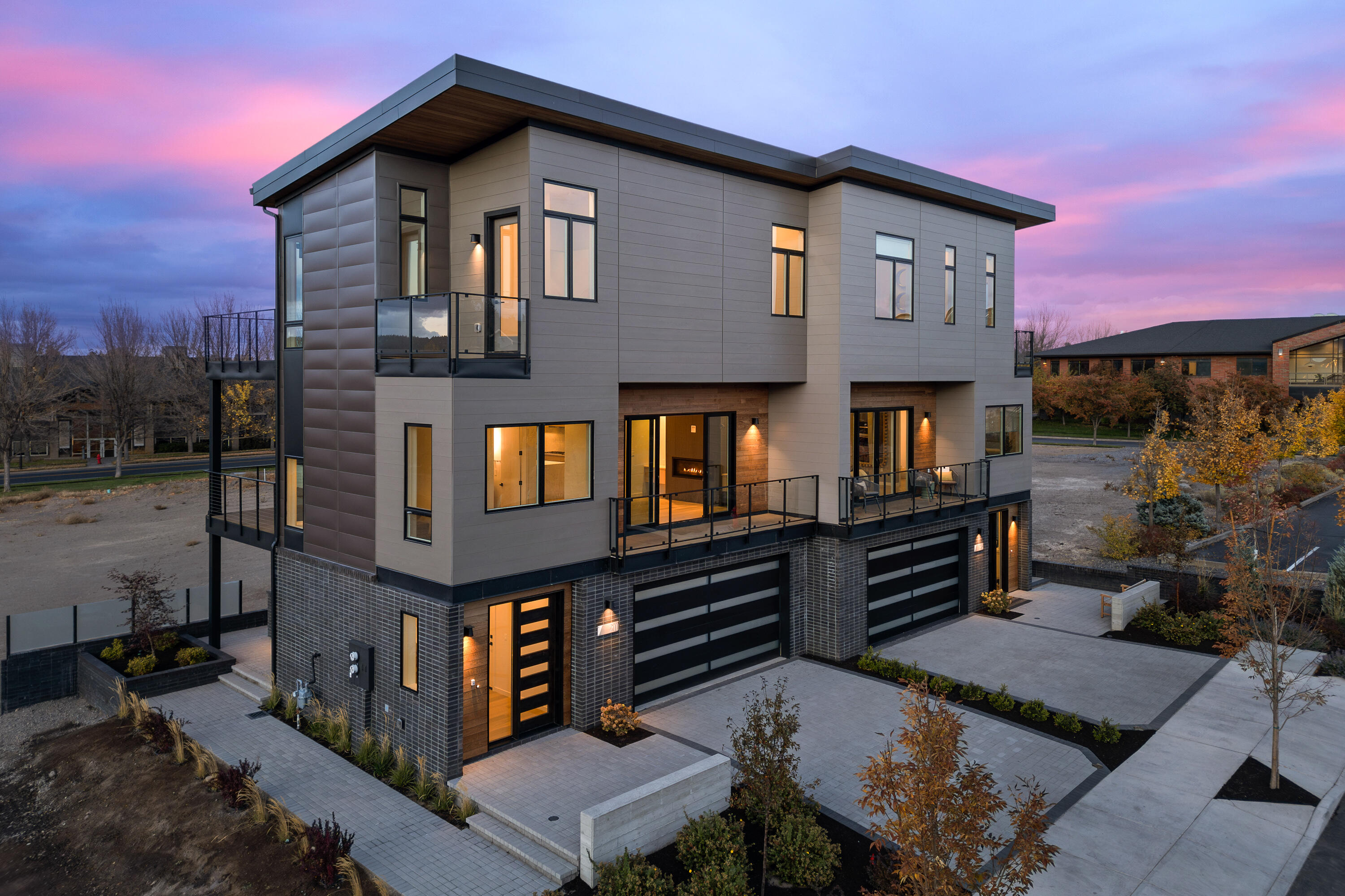 Just a stone's throw from The Box Factory, Crosscut, Crux, The Shops at the Old Mill and a few blocks to Downtown Bend, this is a prime location in the heart of the Old Mill District with easy access to everything including shopping, dining, fitness, Deschutes River, trails, concerts, night-life, and Hwy 97. Features include 3 bedrooms, an open great room concept, ample outdoor deck space, a lock-off permitted ADU/flex space downstairs with its own entrance, private bath, all kitchen appliances and separate laundry. These stunning contemporary townhomes, decked out in designer finishes, do not have any overnight rental restrictions including the City of Bend's 500 ft short term rental restriction. HOA amenities include exterior building and landscape maintenance. Incredible location for a luxury lock and go primary residence, vacation home or income producing property.