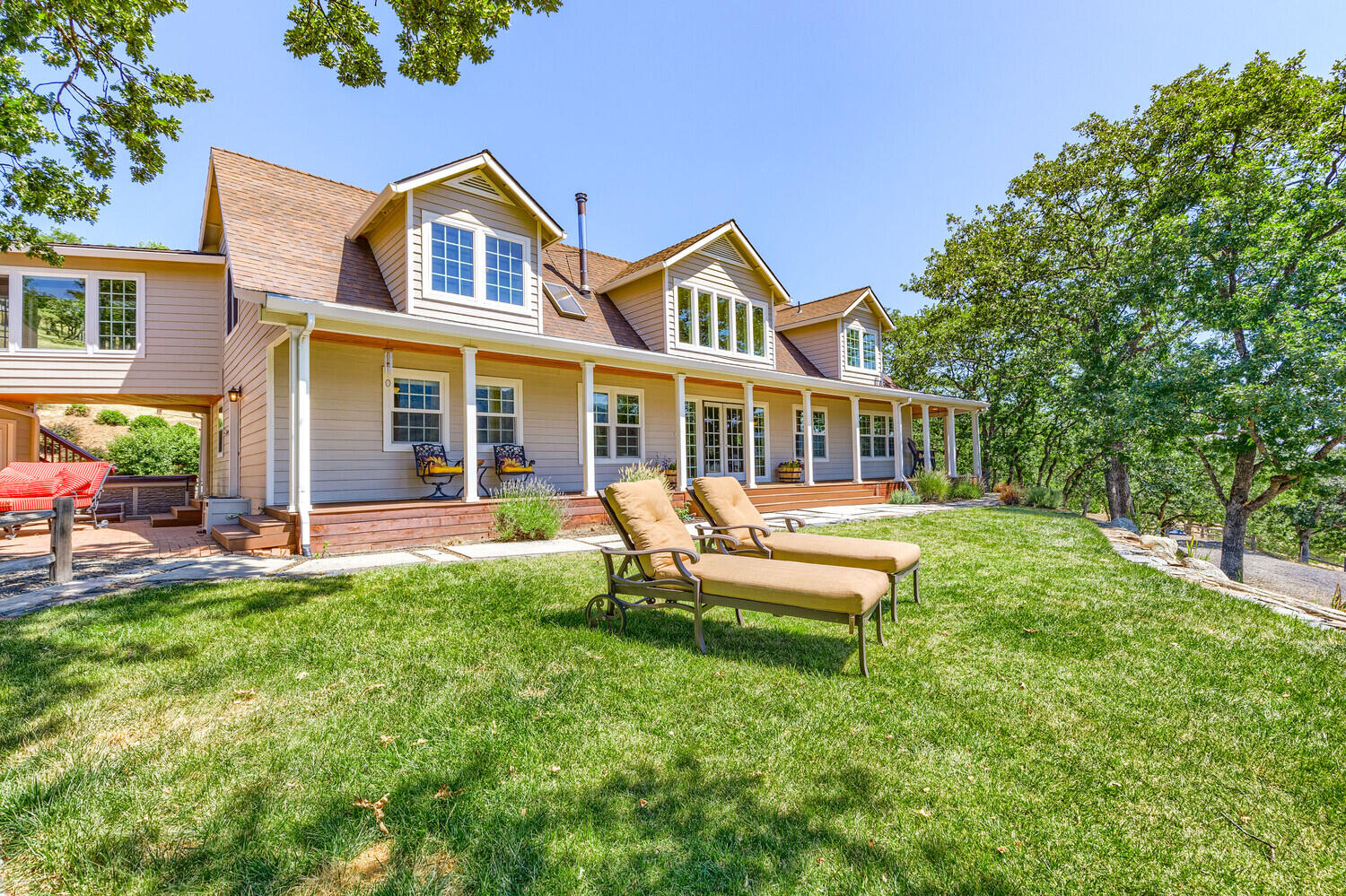 Discover multi generational luxury living at 6015 Dark Hollow in Medford OR. This home offers 5 acres, amazing views, wrap around covered decks, over 4,200 sqft. w/2 primary en suites (1 upstairs and 1 downstairs) 2 other bedrooms, 4.5 baths & 3 fireplaces (2 propane, 1 wood stove).  Step inside & be greeted by a grand foyer with floor-to-ceiling windows that allow the sunshine to bathe the Livingroom.  The beautiful gourmet kitchen has abundant counter space & huge breakfast bar island. The main level & backyard w/expansive decks,
outdoor kitchen, patio are wonderful for entertaining!  The Hot Tub is great for you to unwind and savor the beauty of nature.  Wonderful location near Historic Jacksonville, Ashland, and esteemed medical facilities like Asante & Providence Hospitals are appx 20 min. away.  So with its impressive views, and unbeatable location, this residence offers luxury, tranquility, and convenience. Schedule showing today