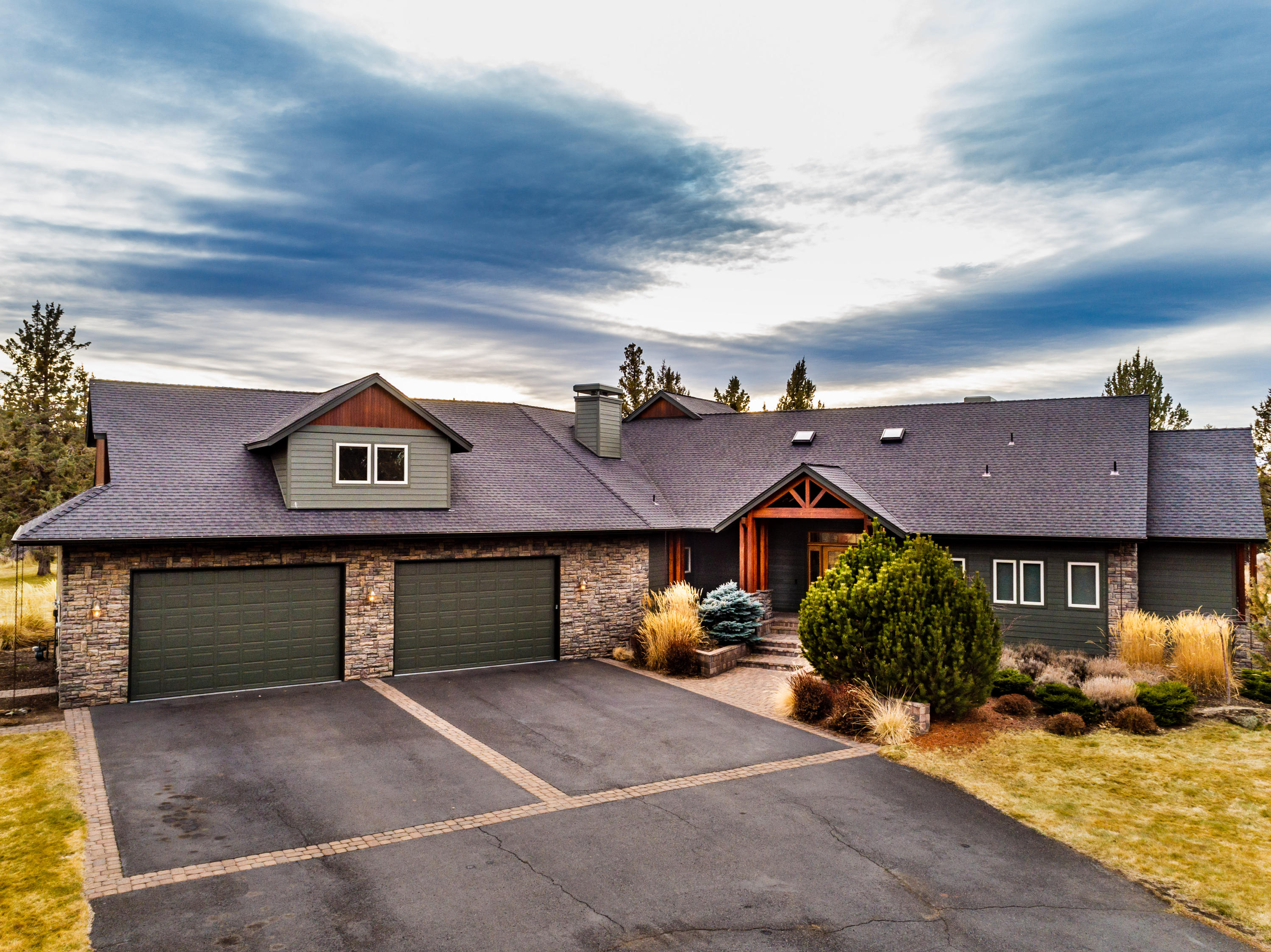 You will love this meticulously cared for estate bordering the city limits. Country living in town, this 4896sf lodge-style home is beautifully appointed and has every box checked. Immaculate home has a grand entrance with a gorgeous living with floor to ceiling windows overlooking the Cascade Mountains. Sitting on a flat 2.84 acres this property boasts an enclosed drive thru RV garage with 858 guest house above. Master on Main, office, bonus room, great room formal dining formal living and 4 car garage are just a few of the amenities. Your oasis awaits.
