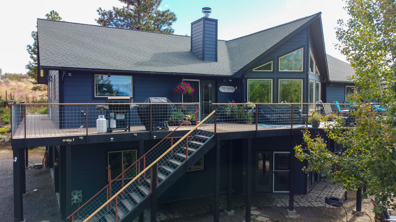 Beautiful Custom Built Home in Oregon Shores 2 with Views of Agency Lake! This Spacious home features 3 bedrooms, 2 full baths on the main floor with a Wet Bar in the dinning room. The kitchen has a  new refrigerator and cook top. There is an additional bath and game room on the lower level.  The main Bedroom includes a Soaking Tub. Custom Cabinetry, Granite Counter tops, Double Fireplace that opens to the Dining and Living Room, A new combo broiler for heat on upper and lower level, Wired for sound throughout and a beautiful Two large Upper Decks! Inground Sprinklers. Hot Tub is included.  There is a 6 car pass through garage and walk out basement that has 8 ft doors! There is access to Oregon Shors Recreational Club for members only.