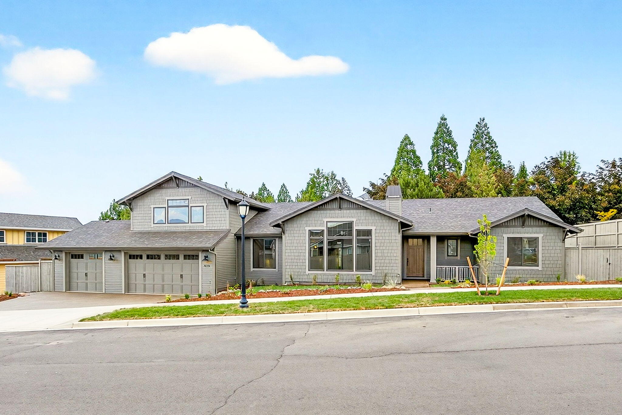 Stunning new construction home in the highly desired Summerfield Subdivision in East Medford. This residence offers an open floor plan with all main-level living and a bonus room upstairs. The bonus room has a bathroom and could be used as another bedroom. The spacious kitchen has a large island, butler's pantry, quartz counters, Kitchen aid appliances, and soft close drawers. The main-level primary suite boasts a spa-like bathroom with a double vanity, floating tub, walk-in shower, and a large walk-in closet. Additional features include a gas fireplace with built-in wood cabinets, real engineered hardwood floors, and excellent lighting throughout. Designed for both style and functionality, the home offers 3 1/2 bathrooms, carpeted bedrooms, and tile in the bathrooms and laundry room. The outside of this home offers a generous covered back patio and a private backyard. More highlights include the 3-car garage and its great curb appeal.   The listing agent is related to the seller