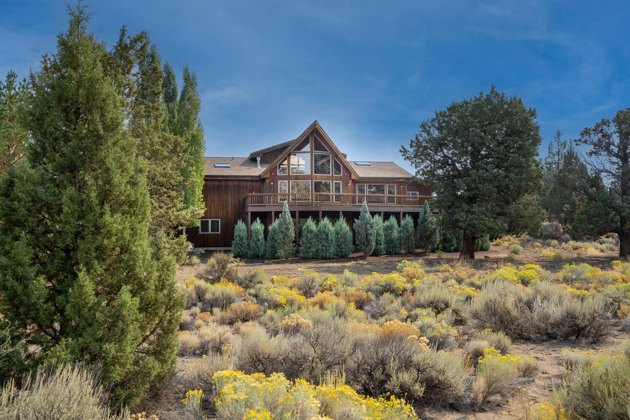 Fabulous one owner home in Boonesborough on 2.54 acres. This custom built classic Lindal cedar home blends modern w/traditional & offers beautiful main floor living, quality finishes & tons of wood accents. The great room has soaring ceilings, gas fireplace & is flanked by a wall of windows creating an inviting light-infused room that will surely be hard to leave.  Gaze out at beautiful trees & nature from almost every room. A spacious kitchen w/ stainless steel appliances & a large island is made for entertaining & cooks! A large primary ensuite & guest BR /bath make up main level. A cozy loft above the LR has sunset and mountain views! So many possibilities on the lower level with its own outdoor entrance, 2 bedrooms, custom dry sauna, hobby area w/built-ins and a finished bonus flex space. Situated in a private & peaceful setting, this home is so appealing & inviting you won't want to miss checking out. Only a 15 minute drive to downtown Bend & the Redmond airport.