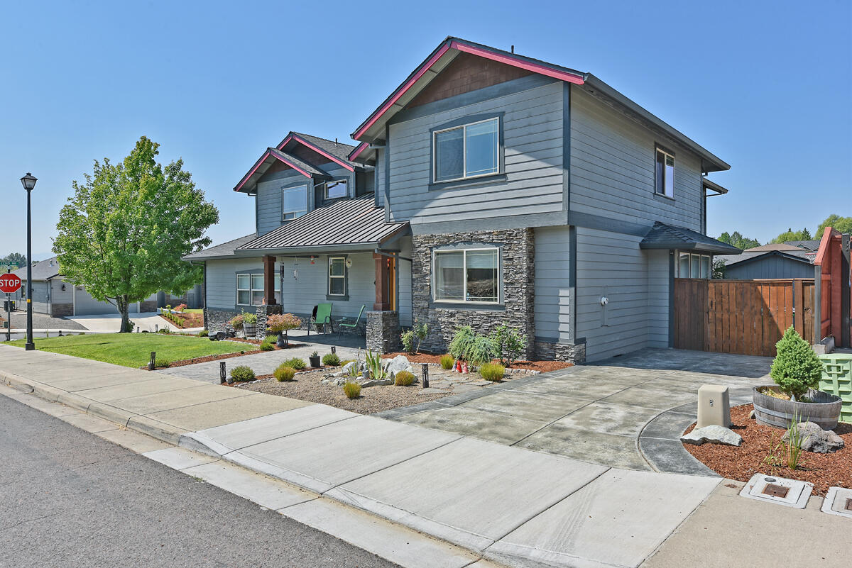 Stunning 4 bedroom 2.5 bathroom home in a highly desirable Eagle Point neighborhood close to the Eagle Point Golf Course. The home boasts 2,675 square feet and an open interior w/10'-18' ceilings, accent archways, and a wall of windows that flood the house w/natural light. The custom kitchen features an island w/breakfast bar, stainless steel appliances including an impressive Built-in Frigidaire Refrigerator, granite countertops, and oversized pantry. On the main level you'll find a half bathroom, and an office/den/additional bedroom w/a cozy fireplace. Upstairs are 2 guest bedrooms and an extra large master suite w/stunning views, a walk-in closet, a large soaking tub and double vanity. The house also boasts a meticulously maintained, oversized, finished 3-car garage w/shop area that includes a 1500lb shop lift, RV parking, a hot tub, a covered patio, and a large fenced-in back yard.  You can't beat the amenities this home offers!  First American Home Warranty included