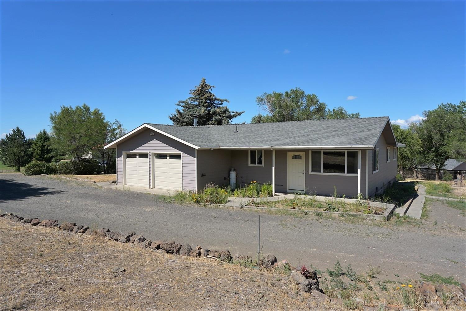 Nearly a full acre with water rights ready for your family and animals. Private setting. Don't miss this opportunity.