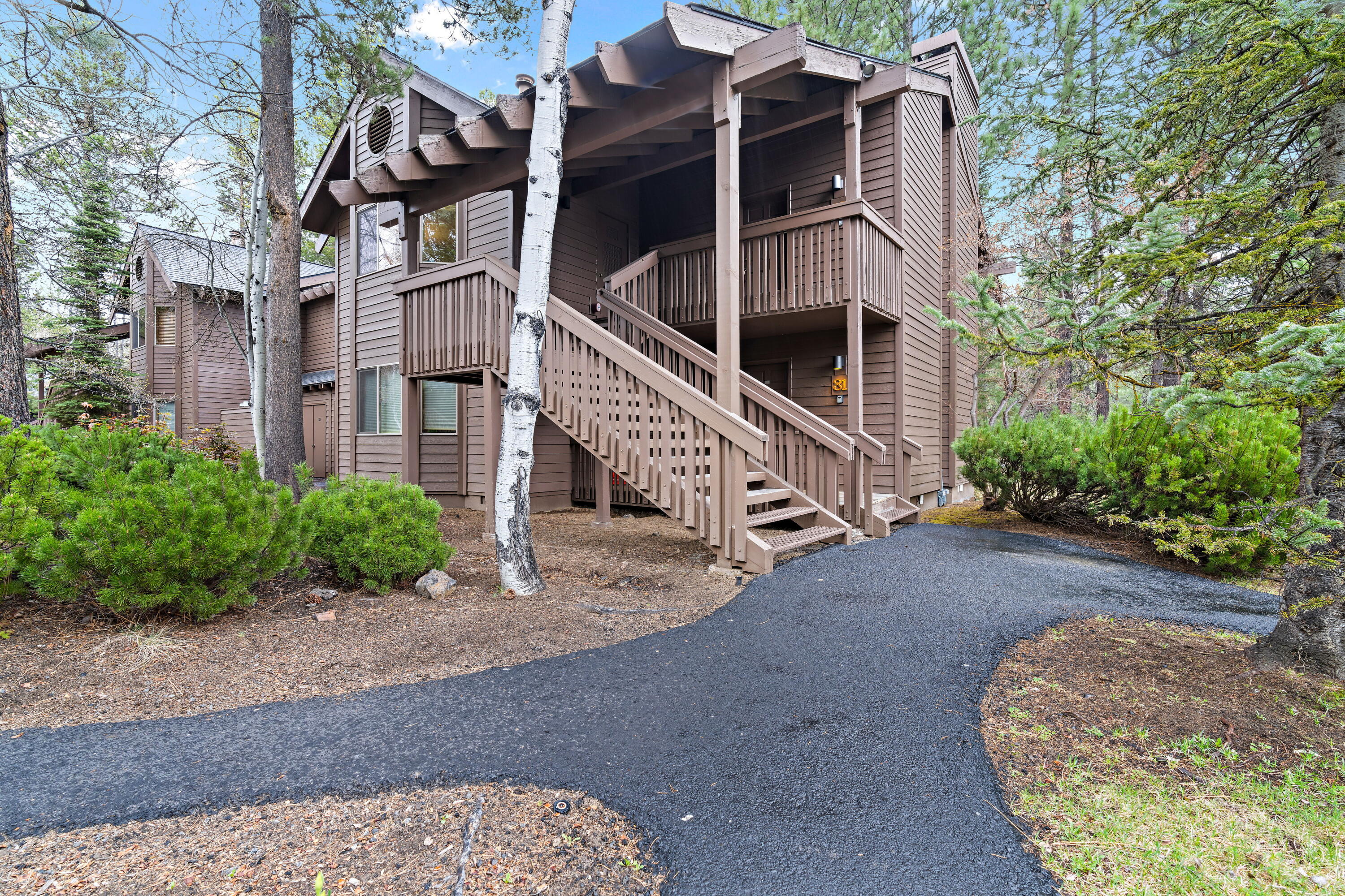 Welcome to The Ridge a turnkey, fully furnished 2-bedroom, 2-bath upstairs condo in Sunriver. Vaulted ceilings and a skylight flood the open living/dining area, highlighting the beautiful flooring. Cozy up by the gas insert fireplace or unwind on your private deck overlooking lush green space. Each bedroom offers ample closet space and easy access to a full bath. Just steps away, enjoy the community pool, hot tub, and miles of scenic biking and walking trails. Rentable, service dogs allowed, no smoking property, this condo is perfect as a get away retreat. Don't miss your chance to own a slice of Oregon's premier resort community—schedule your showing today!