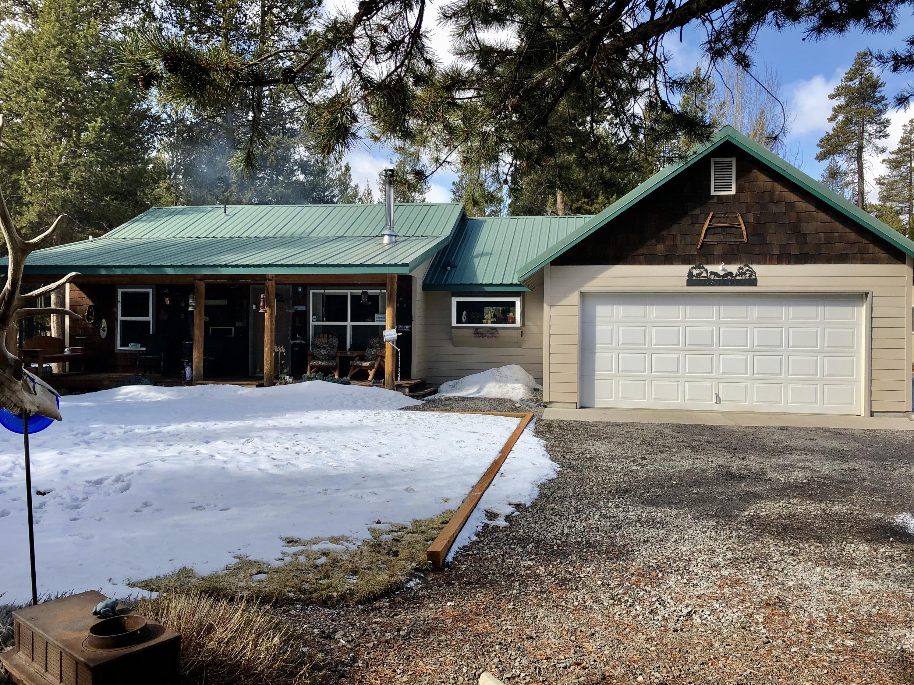 Don't miss this Beautiful well maintained 3 bedroom 2 bath Frame Home. Built in 2000 on just over an Acre located on a paved road.  Property is fenced with gaited access.  Home features an attached two car garage as well as a 30x40 shop.  The Shop is wired for 220, with multiple plug ins and an area that can be closed in with heat.  Large carport or wood storage. Woodstove, new vinyl flooring, metal roof, beautifully landscaped yard, and a Greenhouse.   This property has all you will need to make your forever home in Beautiful La Pine Oregon!
