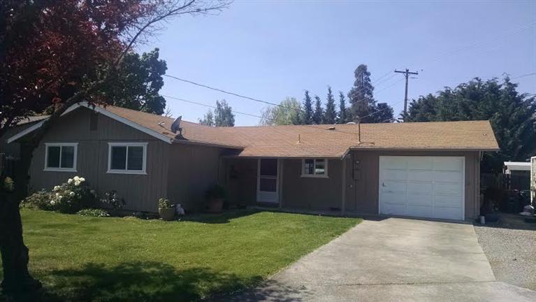 Nice home on huge corner lot. This home was just remodeled w/a new kitchen featuring hickory cabinets, flooring, paint, island, and counter tops. The kitchen looks into the living room. Three large bedrooms with 1 1/2 bathrooms. Great pellet stove in the living room ro provide ample heat. Outside you will enjoy the large backyard with RV parking behind a gate w/access to Pine St. If you need more RV parking or parking in general you can access more space off of Vincent. The garage has been converted to additional living space.