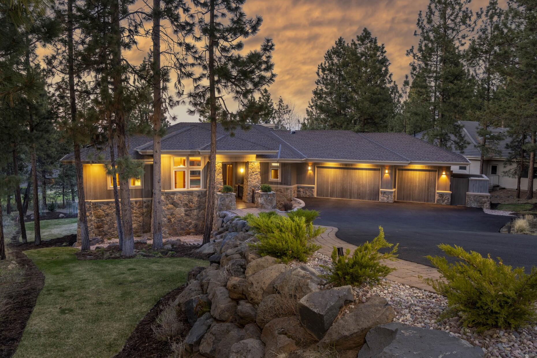 This impeccably updated retreat balances luxury finishes & contemporary design w/ a welcoming aesthetic that will make you never want to leave home. Set back off the road on the 9th hole of the Awbrey Glen golf course, this completely redesigned home features a stunning kitchen w/ rare Dragon Red granite countertops & extensive wood cabinets, as well as an appliance drawer & butler's pantry for the discerning home cook. Off the kitchen, a sunken living rm features a gas log FP & soaring windows to take in the golf course views. The main-level primary suite looks out onto the same views & includes a gas FP & spa-like BA w/ jetted tub & W/I tile double shower. Two W/I closets provide space for all. In the daylight lower level, find two more full suites, as well as a flex rm. Host watch parties in the large family rm on this level w/ well-appointed wet bar, surround sound, & deck access. This home also offers a main-level office, large laundry/mudrm,  3-car garage, & tons of storage.