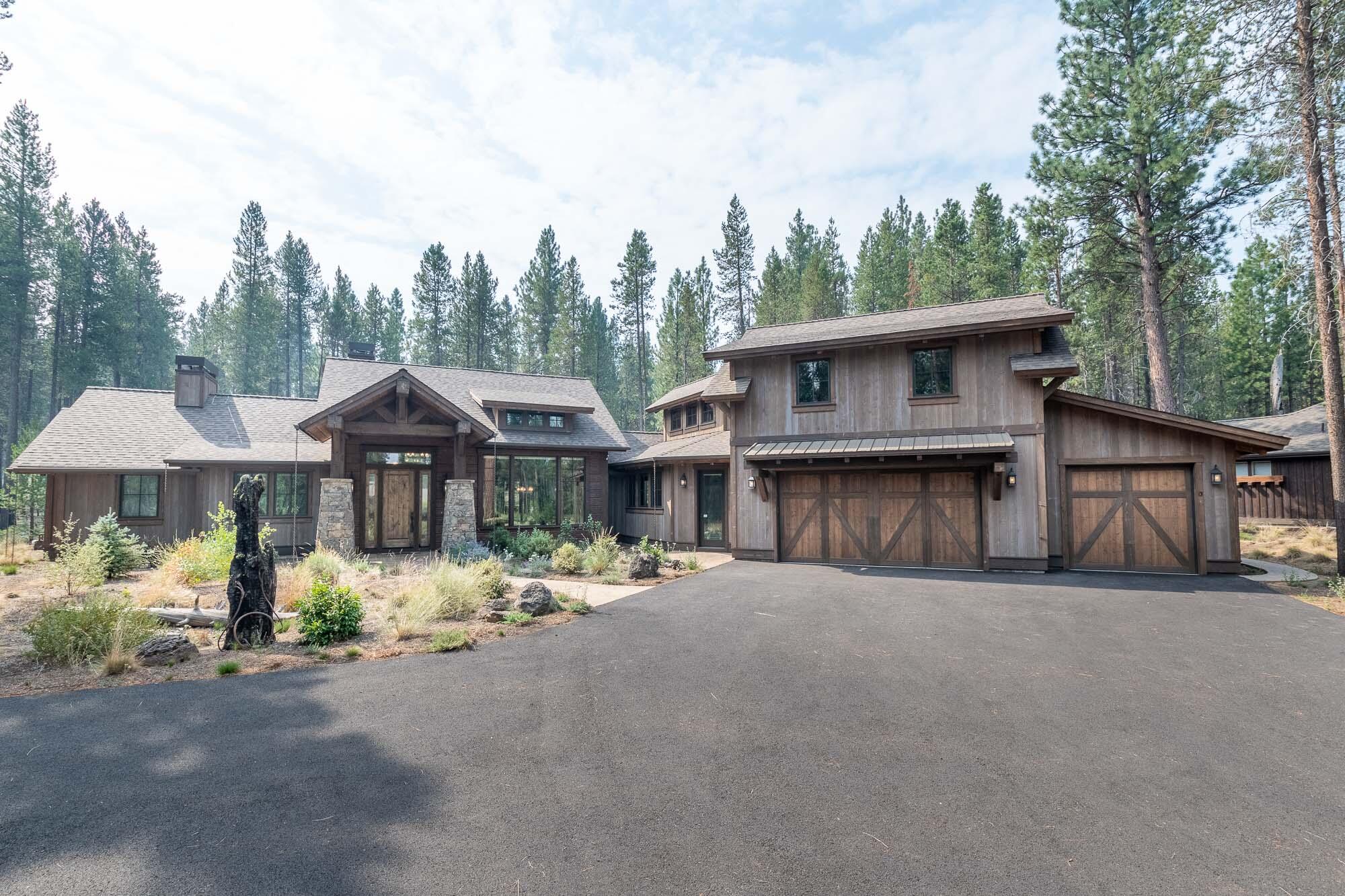 Luxurious home on a private & large 0.64 acre Estate size lot in the premier gated community of Caldera Springs! Perfectly appointed 2,892 sq. ft. home with 2 main level bedroom suites, powder bath and office on the lower level plus 2 bedrooms, full bath & bonus room upstairs. Open layout of the kitchen, dining, & great room is perfect for entertaining. High end finishes & gorgeous architectural elements include soaring ceilings, beautiful hardwoods, exposed trusses & ironwork & natural stone make this a warm & inviting retreat. Enjoy year-round outdoor spaces including a large, covered patio w/ gas fireplace, covered hot tub enclosure, BBQ area & nice fire pit out back. Lg laundry room, 3-Car garage & A/C.  Community amenities include Caldera Links, Zeppa's Bistro, the Quarry pool, tennis, fly fishing, kayaking, & 9 miles of trails—all just minutes from Sunriver, Mt. Bachelor, & Bend. Bring the whole crew to your luxury retreat for year 'round activities! Don't miss out!