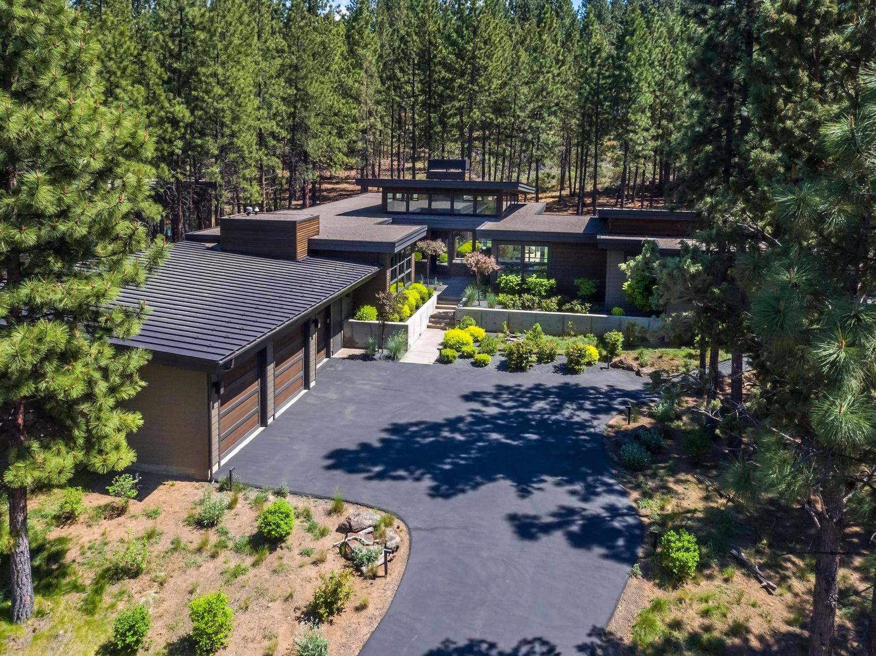 Stunning contemporary home, nestled in the woods on a quiet cul-de-sac in Tetherow. The single level plan, along with the detached casita, form a secluded & peaceful outdoor living area. The great room & office create good separation between the master suite & 2 guest bedrooms. Featuring a large quartz island, the open kitchen is designed for entertaining. Floor to ceiling windows bring the outside in; hardwood floors throughout, elegant lighting, & well designed bathrooms & closets. The master has a private entrance to the hot tub & outdoor shower. The casita, with full bath, is perfect as a guest/art studio or home gym. All offered with tasteful furnishings, selected to complement the clean and minimalist style of the home. Great 3-car garage, over 1000 sq ft. Native landscaping in the front; grassy back courtyard with a fire pit & covered dining. A fabulous location, close to schools, golf,
biking trails, downtown Bend, & the road to Mt Bachelor.