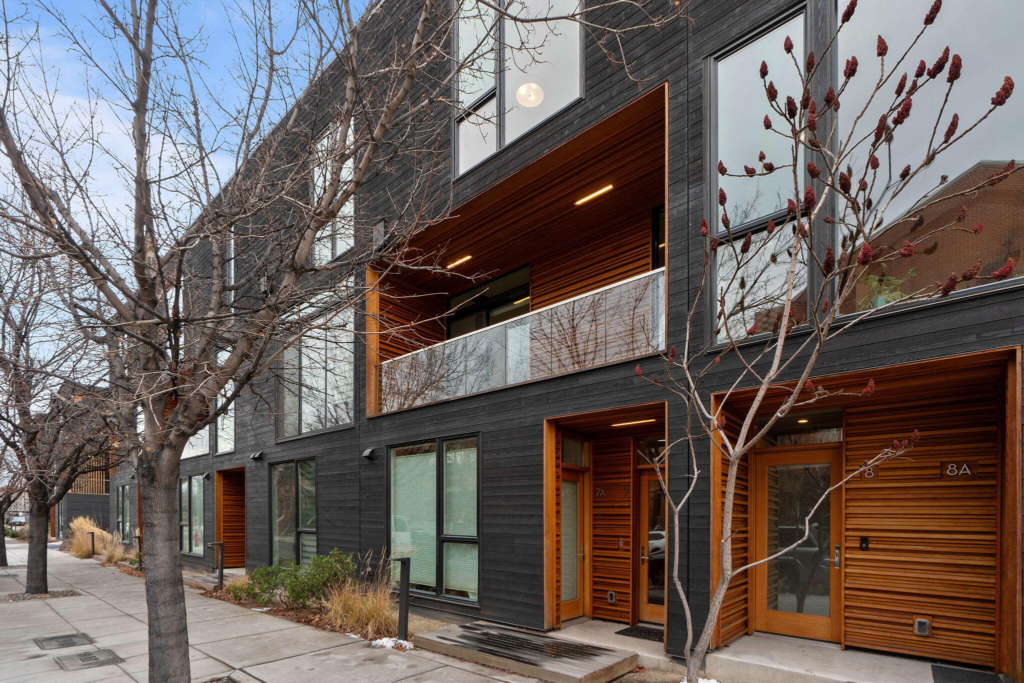 This stunning, modern Basecamp townhome is in the heart of Bend, with easy access to the Deschutes River, Old Mill and downtown.  Comprised of two living spaces, this property includes a two bedroom townhome as well as an Accessory Dwelling Unit on the first floor with a separate entrance, kitchenette & its own private bath.  In the primary unit you will find an open greatroom with a spacious kitchen, cozy living area and separate dining space overlooking private courtyard views. Upstairs are two private bedrooms and an open loft space, which can be utilized as a den or office area. This home is perfect to enjoy sun soaked mornings on the balcony, stroll to nearby shops and restaurants or grab a concert chair and walk to the amphitheater at the Old Mill for a show...truly Bend living at its finest!