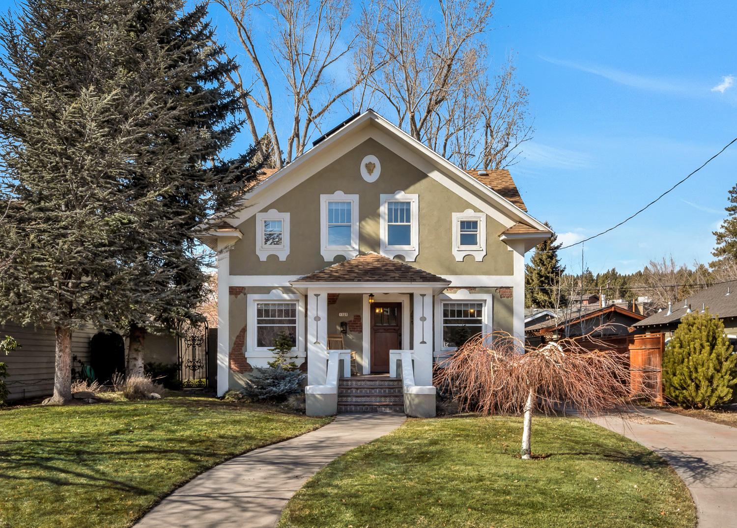 One of a kind Westside 1924 Historical Emil Wienecke House underwent a full vintage restoration w/a high degree of craftsmanship truly unique to any other home in Bend. The house comes with a transferable short-term Vacation Rental permit, fully furnished and has a strong 10-year history. Great opportunity for a primary residence, 2nd home or STR investment. Abundant natural light & high ceilings give this home a spacious feel throughout. 1st floor: formal living & dining, wood fireplace, kitchen w/ informal dining, bed &1.5 baths.  2nd floor:  Master Suite w/private bath, 1 additional guest bed & bath & Large Family Room. Finished Basement offers Bonus/Media Room, laundry, storage, access to exterior. Grid-Tied Solar PV System. New HVAC & Water Heater in 2020, 400sf Garage, Block Wall Fence, Private Paver Patio & Firepit. Covered Porches. 2.5 blocks from Harmon Park, Mirror Pond & the Drake Park footbridge. Close to Downtown, Galveston & Newport corridors, this is a must see!
