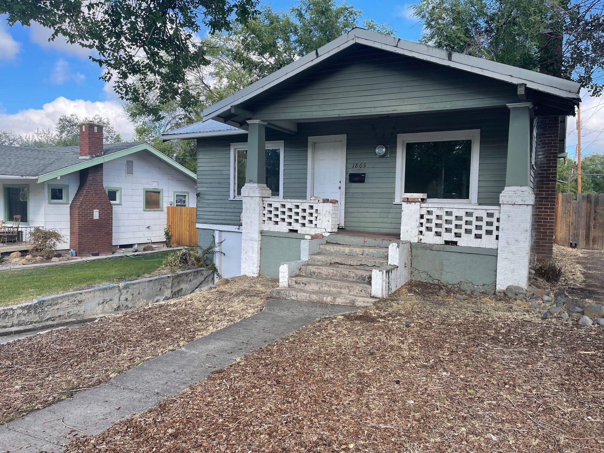 Hot Springs area home! 2 bedrooms on the main floor and one in the basement area. Buil-ins. Gas wall furnace. Fireplace. Large back yard and back deck. Enclosed back porch. All of the basement sq ft is included in the below grade area. Home needs some work and is priced accordingly. Tenants have 90 day rights.