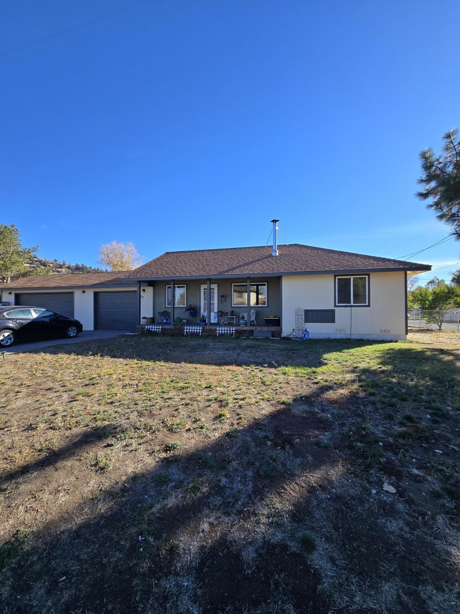 SELLER IS VERY MOTIVATED! Don't miss this gorgeous, updated home in Dorris! This spacious 2-bedroom, 2-bath home features an additional bonus room/office and a huge garage with a bar area. Recent updates include a new water heater, kitchen appliances and backsplash, lighting throughout, toilets, mirrors, faucets, drapes, electrical outlets, and a living room fan. Enjoy the new fireplace in the living room and new wall heaters in each bedroom. Take in stunning views of Mount Shasta from the large fenced backyard, complete with a barn and brand-new chicken coop. Exterior improvements include new siding, a side fence, stained back deck with railings, and freshly painted siding and trim. Easy to show—schedule your appointment today! CA DRE 02145244/FNR CA DRE 02074761