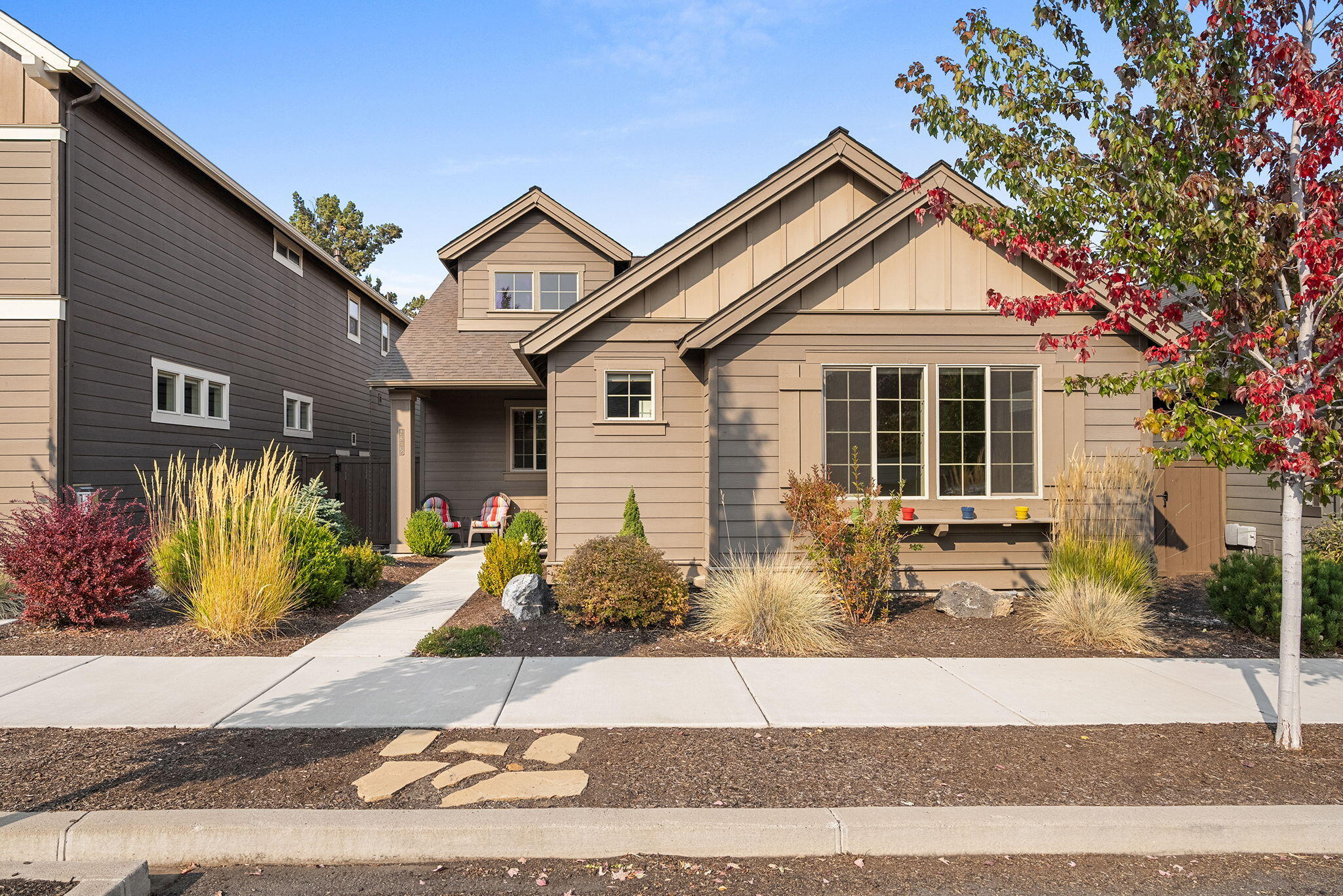 Welcome to charming Parkland in SW Redmond, where convenience meets comfort! This delightful 3-bedroom, 3-bath home, built in 2016, features a modern great room floorplan. The stylish kitchen is equipped with stainless-steel appliances and a walk-in pantry, perfect for culinary enthusiasts. Cozy up in the spacious living area with a gas fireplace, ideal for chilly evenings. Step outside to an inviting paver patio, perfect for outdoor entertaining. With two primary suites—one on the main floor and another on the second level— this home offers flexibility for all lifestyles. Enjoy LVP flooring, solid surface counters, and ample storage throughout. Additional highlights include an alley-load garage for convenience and a quiet dead-end street. This home strikes the perfect balance of style and functionality in a sought-after location. Plus, you'll benefit from a well-managed HOA and Redmond schools. Don't miss your chance to make this gem your own!