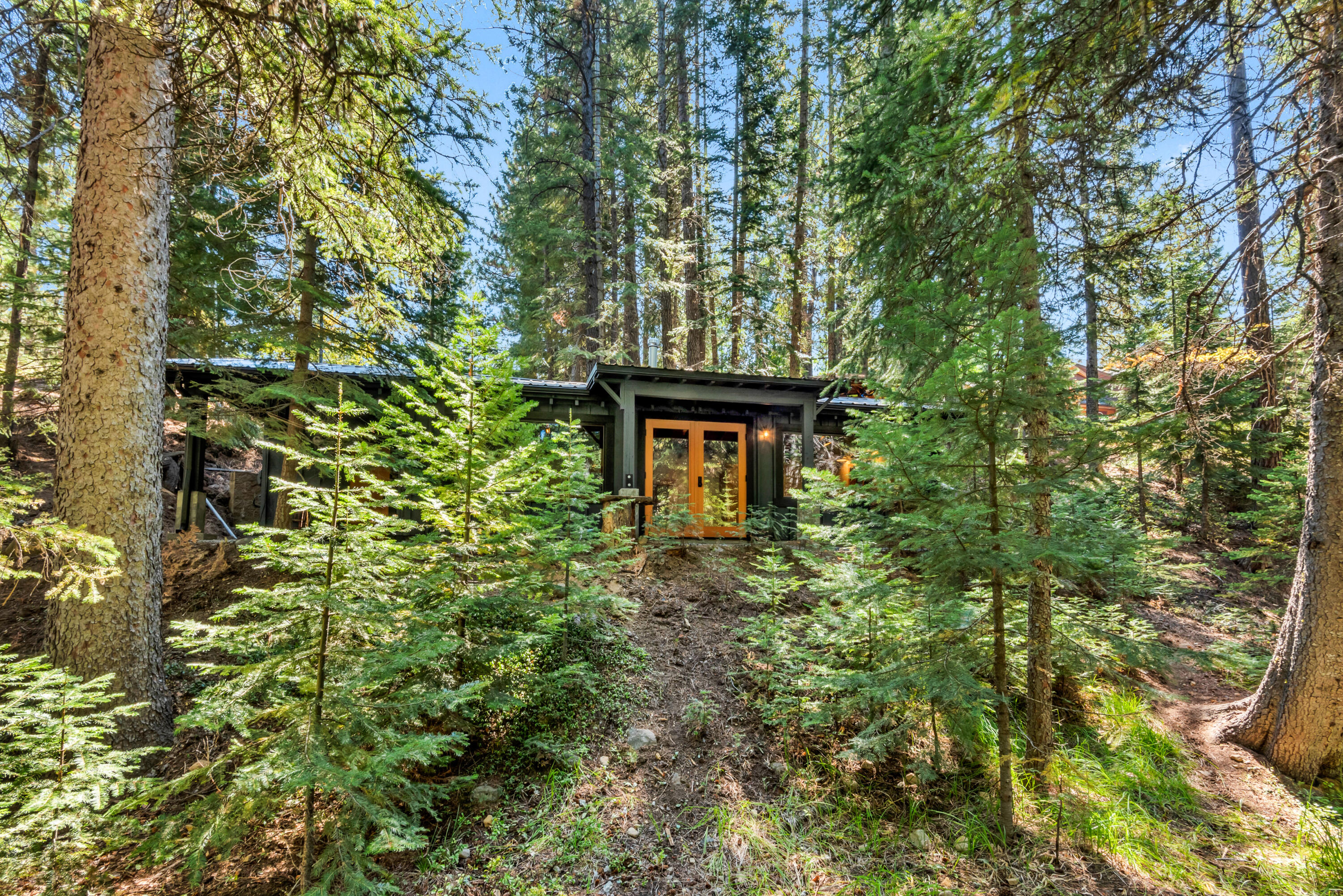 A rare opportunity to build your dream home on 185 feet of Tumalo Creek frontage. This is the last vacant double lot on the south side of Tumalo Creek in the Historic Skyliner Neighborhood/Community, which is surrounded by 1000's of acres of Deschutes National Forest and situated 3 miles downstream from Tumalo Falls, and 8 miles west of Discovery West, Tree Farm, & Westgate at the base of the Cascade Mountains. These two elevated sun-filled parcels are being sold together for a total of 0.92 acres with septic feasibility approval. Enjoy the peaceful sounds and delightful views of this year-round creek from the fully renovated 546 sq ft Vacation Cabin, which sits on the banks of Tumalo Creek with electricity, high-speed internet, TV and phone but no water or sewer. This one of a kind Oregon mountain setting is just minutes from Bend's westside amenities and downtown. Enjoy 100+ miles of trails, road, gravel, or mountain biking, skiing, trail running, or hiking right out your door.