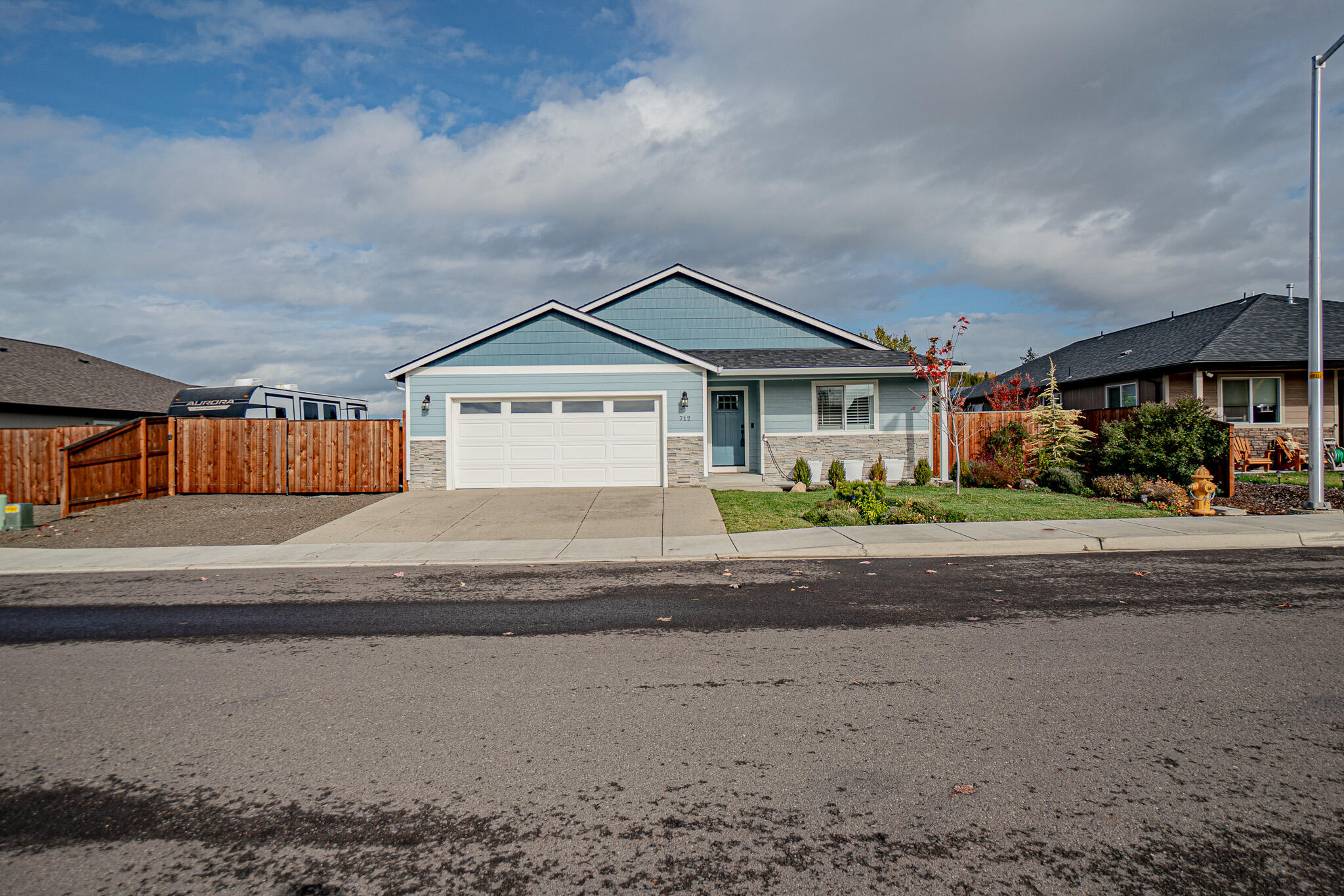 Welcome to this modern 4-bed, 2-bath, turn-key home in a peaceful Eagle Point neighborhood. Built in 2021, this home offers an open-concept layout with a bright living area and a stylish kitchen featuring a breakfast bar, stainless appliances, and ample counter space. Also included is a whole-house electronic air cleaner that effectively filters dust, pollen and smoke. The private primary suite includes a walk-in closet and a well-appointed bath. Three additional bedrooms provide flexibility for guests, work, or hobbies. With contemporary finishes, energy-efficient systems, and a clean, move-in-ready feel, this home offers easy living and comfort close to schools, parks, and local conveniences and just 20 minutes to Medford.