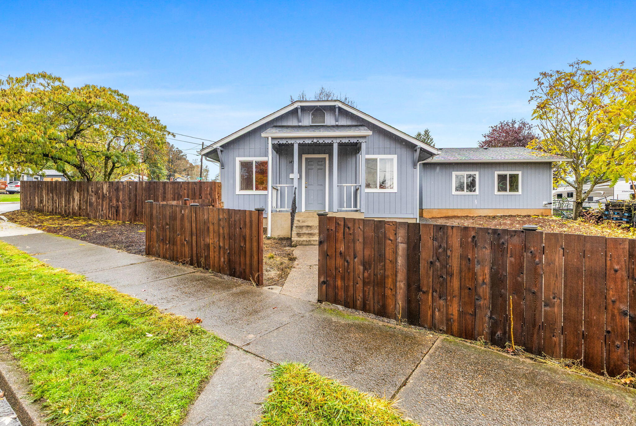 Large-lot home in town with a separate shop! Remodeled from the studs in around 2000, this home has been updated and cared for over the years, and brings many unique features, including abundant parking, a semi-circular driveway and extensive yard space for gardens, relaxation, pets, or play. New roof and AC in 2020, new water heater in 2024, and the home is generator-ready! Cozy interior boasts a functional floor plan and a surprising amount of storage space. Come and experience all there is to enjoy!