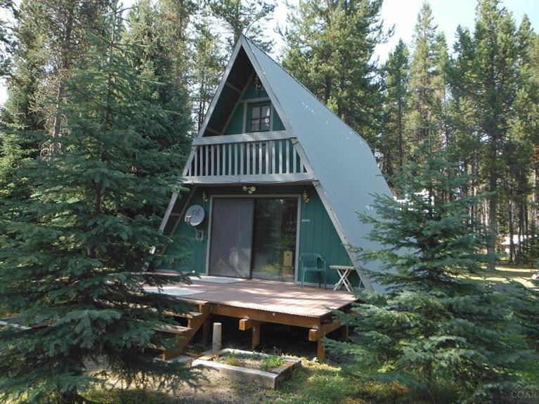 Owner will carry contract with sufficient down. Motivated seller. Adorable 972 sq ft chalet with 3 bedrooms, 1 bath, woodstove, forced air, 2nd floor entertaining deck, Juliet balcony, massive RV garage is 42 x 26 for all your toys and your motorhome with room left over for a work bench, gravel circular drive all on 1 acre corner lot. Minutes from Crescent & Odell Lakes, Willamette Ski Pass, Pacific Crest Trail or snowmobile from your front yard. 3rd bedroom houses washer and dryer but can be moved.