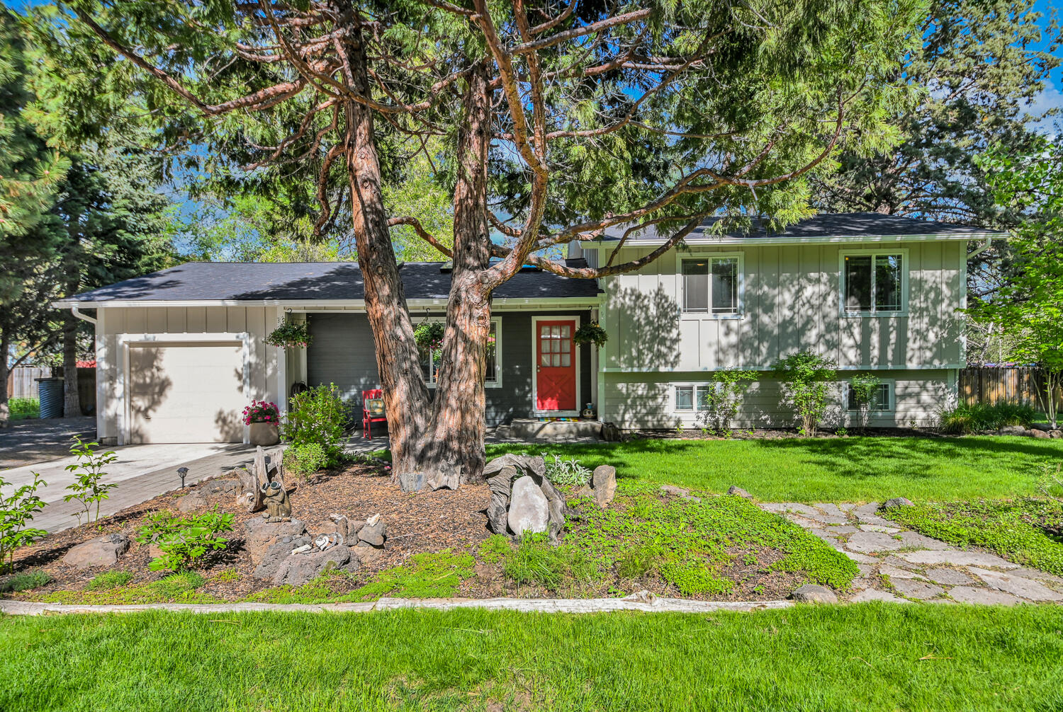 Don't miss out on this legacy Short Term Vacation rental with a transferrable STR permit. This three-bed, two-bath home sits on a large, fenced quarter-acre lot on Bend's popular Westside. The 1730 square foot home boasts an open floor plan with a remodeled kitchen, great room and a finished, daylight basement that serves as a fun bonus room. There is plenty of outdoor space to park an RV or a boat, plus a garage for your toys. You will enjoy being blocks from Newport Market grocery store, award-winning restaurants and beautiful Drake Park. Enjoy the large deck with guests or sit and soak in the hot tub after a day of skiing or biking.