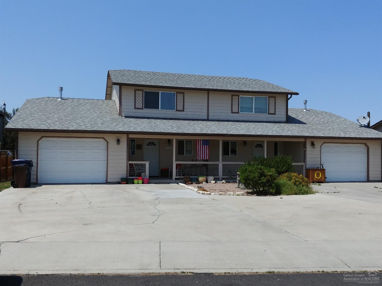 Nice, well-built duplex. All bedrooms are large. One upstairs bdrm has deck off sliding door. Rare find with Master on main level and 2.5 baths. Back patio, spacious yard and large storage building.