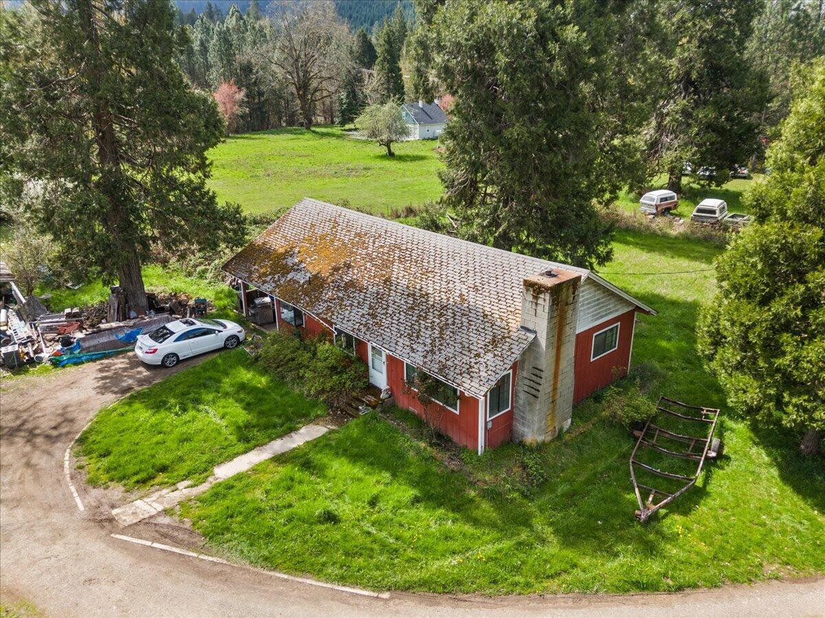 Welcome to a unique country-living opportunity in the charming town of Glendale, Oregon. This two-bedroom, one-bath home sits on 1.22 acre lot and offers the perfect setting for those seeking a rural lifestyle with room to grow. The home features a spacious kitchen with plenty of potential to become the heart of the house. A separate laundry room adds convenience, while the layout offers flexibility for cozy living and personalization. Though the home needs a bit of TLC, it's an ideal fixer-upper for someone with vision and a desire to create their own slice of paradise.Outside, the property truly shines. A large barn adds character and function, complete with an overhead loft area that can be used for storage, a workshop, or transformed into a creative space. The surrounding acreage offers open space for gardening, animals, or simply enjoying the tranquility of nature. Whether you're looking to start a hobby farm or just want space to breathe, this property delivers.