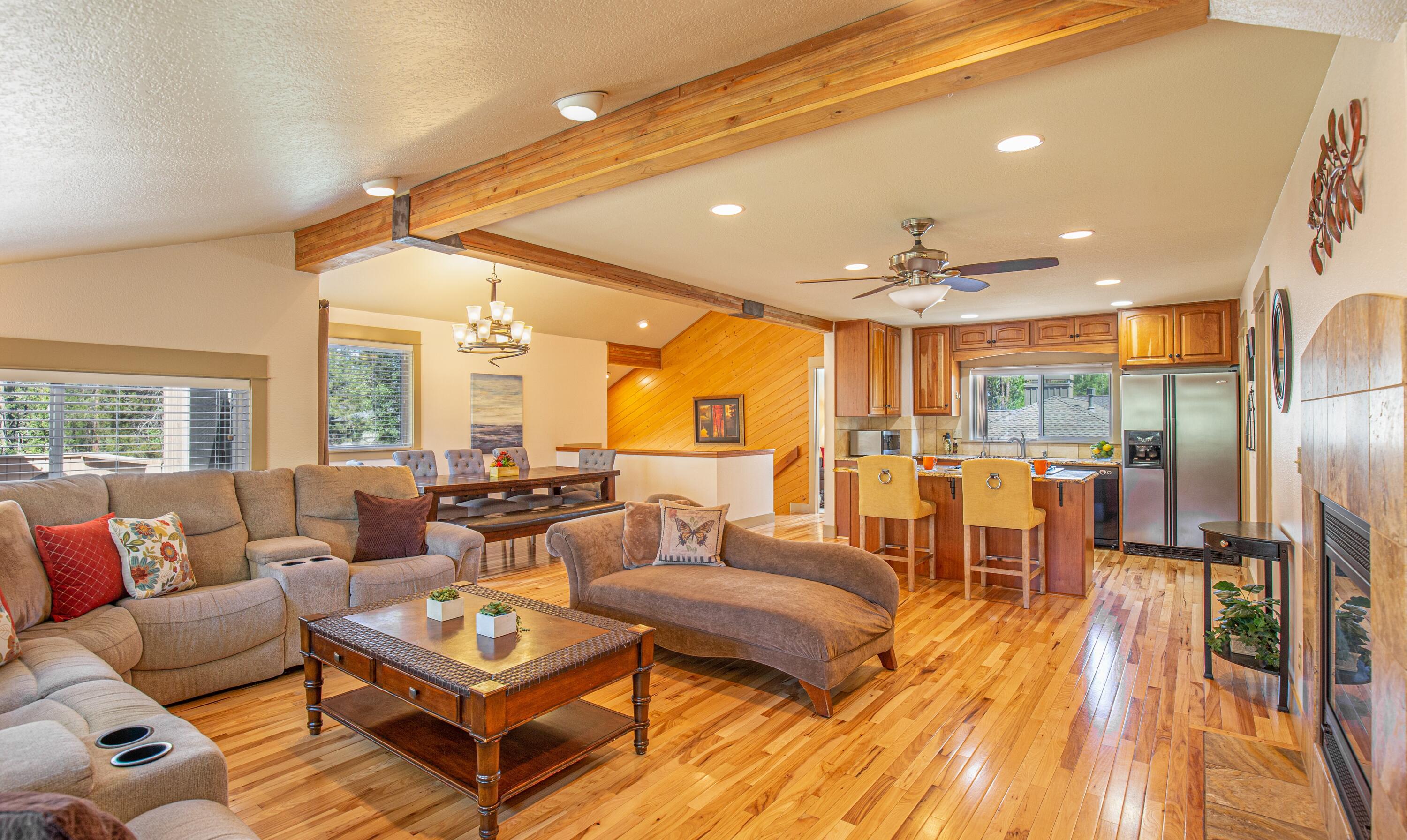 Cherished traditions begin here! Nestled on a private .25-acre homesite, this well-maintained and nicely furnished home provides fantastic separation of space and plenty of room to get together! Room to spread out in 2,234 square feet of living space with 4-bedrooms--including 2-large suites, 3-full baths, great room, kitchen with breakfast bar, dining area, and 2 bonus rooms. The attached 2-car garage allows storage for all your adventure gear and is currently used as a game room. Generous windows bring the outside in and create a warm and welcoming place for family and friends to gather. A vaulted ceiling, exposed beams, wood floors, and stone and tile accents add rustic charm. Bask in serenity as you enjoy over 300 days of sunshine from multiple decks. Soak under the stars after a day of play in the private, fully fenced hot tub area. Whether you are looking for a full-time residence, an investment property, or vacation home, this is your basecamp for Sunriver adventure.