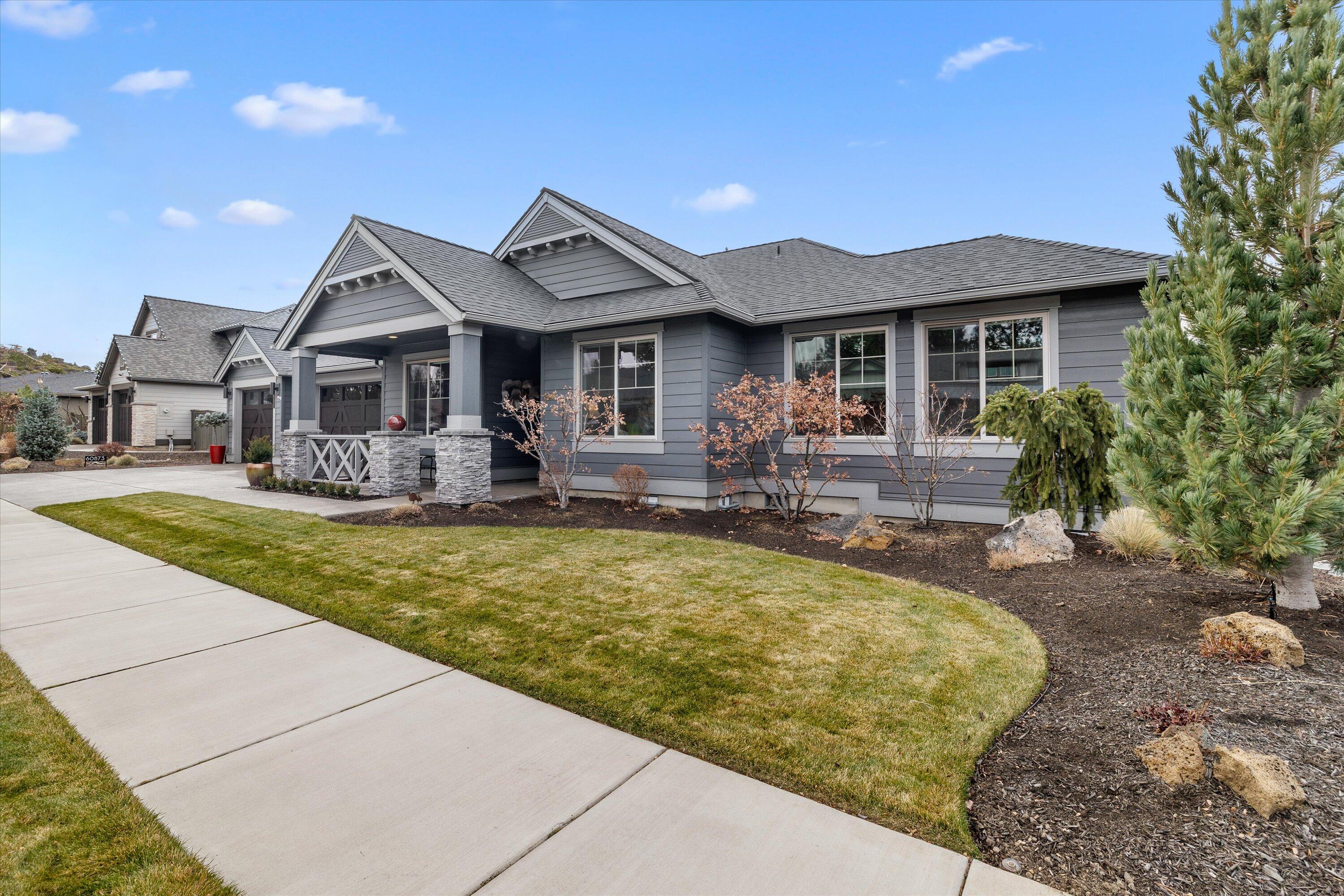 Experience exceptional single-level living in this beautifully upgraded four-bedroom, two-and-a-half-bath home in River Vale, SW Bend. Rich hardwood floors extend throughout the living spaces, creating a warm and sophisticated atmosphere. The open-concept design enhances natural light and offers effortless flow between the spacious kitchen, dining area, and inviting great room—perfect for everyday living and entertaining.Custom glass shelves to display art. Guest bedrooms provide comfort and flexibility for guests, work, or hobbies. Outside, a beautifully landscaped backyard awaits, featuring raised garden beds ideal for growing your own vegetables, flowers, or herbs. Whether relaxing on the patio or tending to your garden, this private outdoor haven offers year-round enjoyment. Completing this exceptional property is a generous triple-car garage, providing ample space for vehicles, an abundance of custom built ins for storage. With its thoughtful upgrades, this home truly stands out.