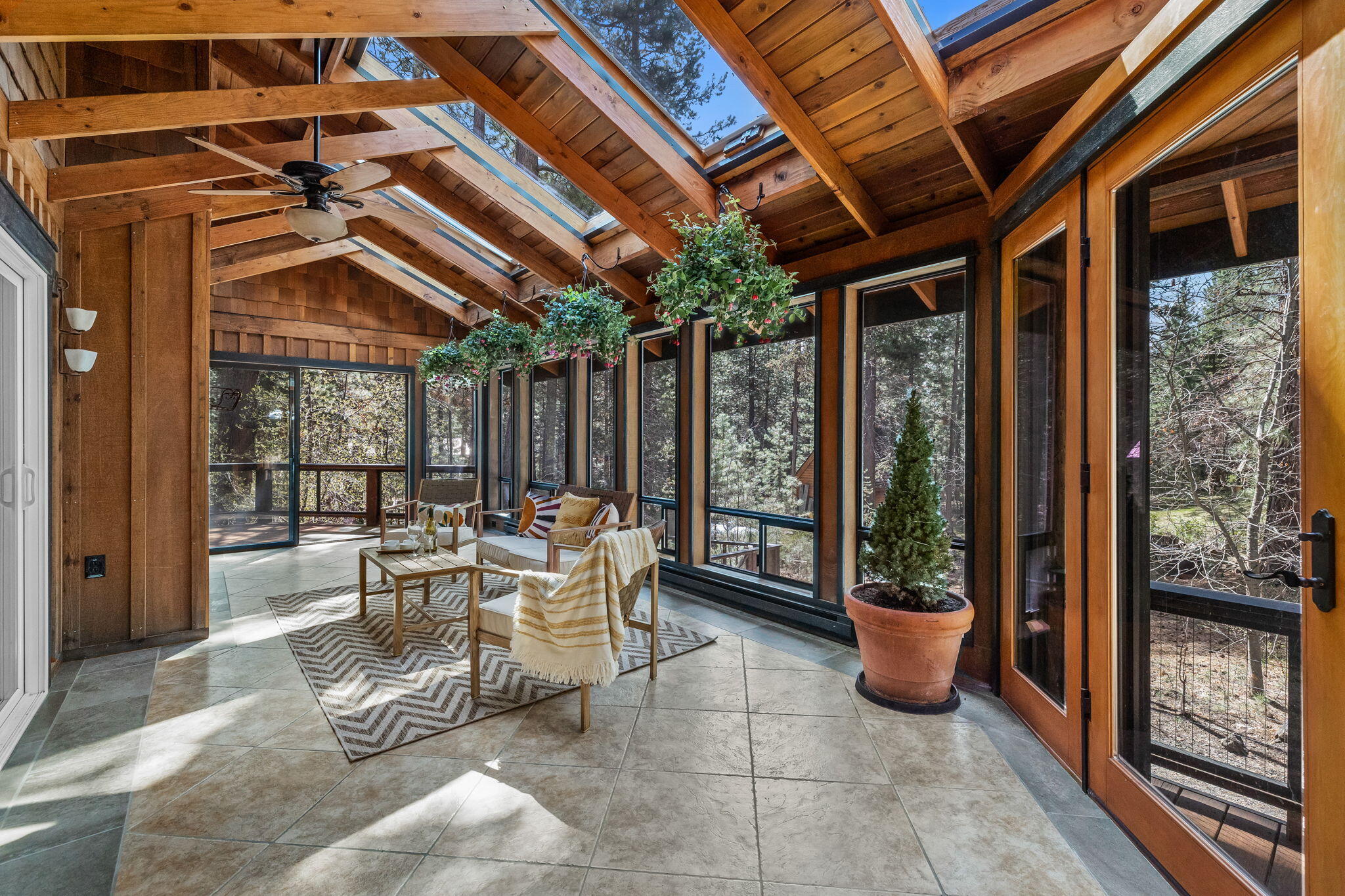 Exceptional home on 1 acre lot with a tranquil waterfall and pond, surrounded by lush pines and steps away from National Forest, offering a perfect blend of privacy and nature. The neighborhood's private river access allows great ease for an afternoon paddle or river float. This home offer loads of opportunities with 3 bedrooms upstairs, main level for entertaining plus lower level with additional bedroom, full bath and living area; that can be locked off and currently has STR permit creating investment opportunities, possible multi-gen living or just additional living space. Gorgeous kitchen with new range and stunning soapstone countertops and copper farmhouse sink and prep sink. The finished shop and additional outbuildings are ideal for all your toys, animals, or recreation space. The sunroom and multi-level decks makes the perfect combination of indoor and outdoor living and is a must-see for those seeking a peaceful Central Oregon lifestyle!